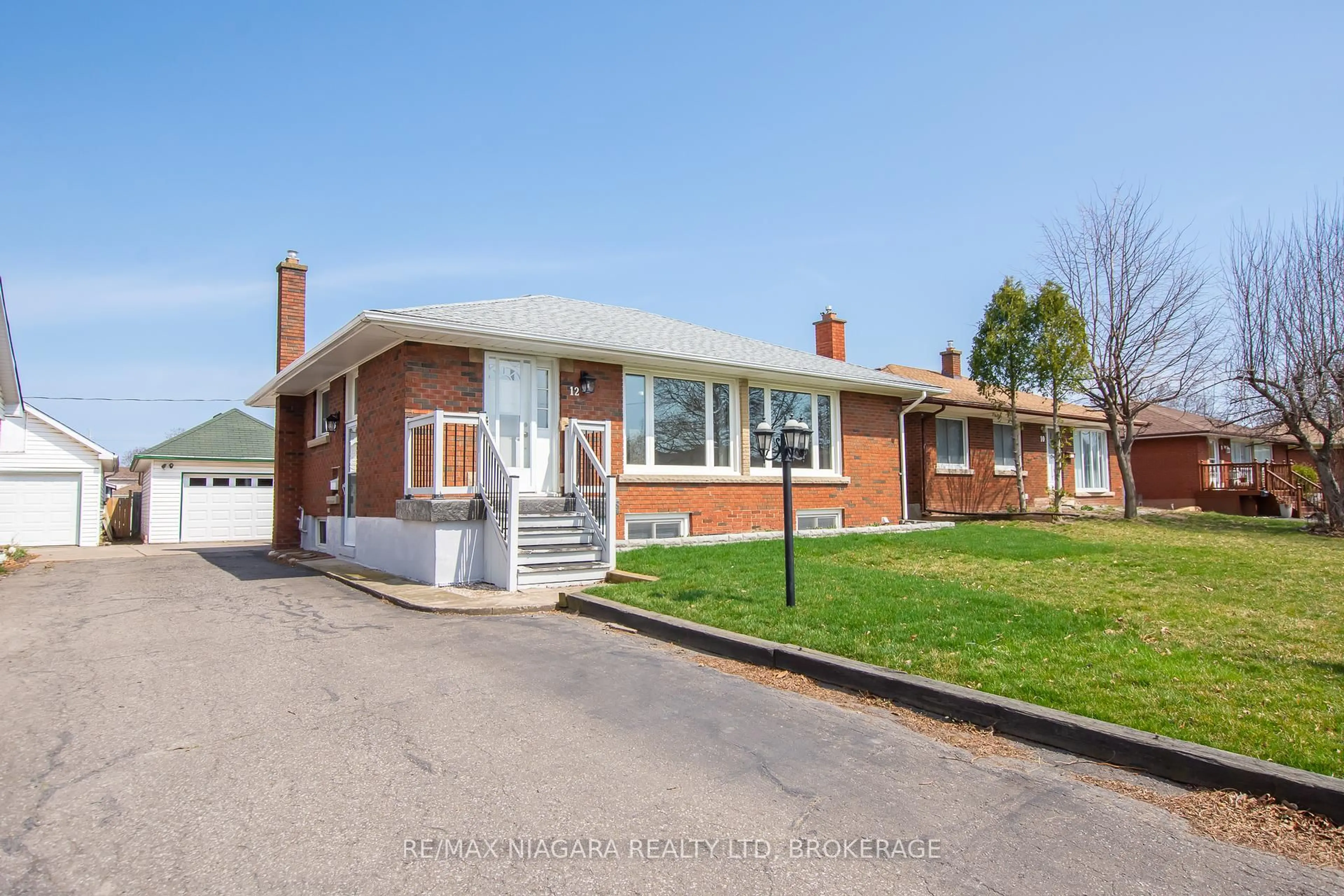 Home with brick exterior material, street for 12 Milton Rd, St. Catharines Ontario L2P 3E8