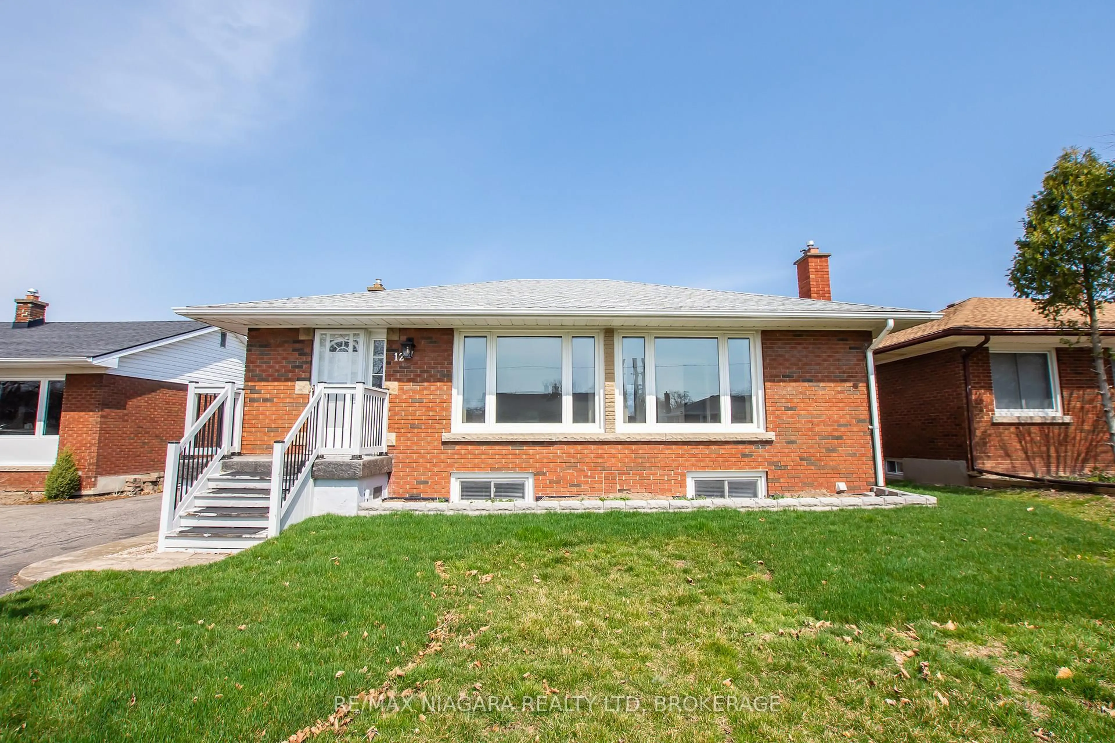 Home with brick exterior material, street for 12 Milton Rd, St. Catharines Ontario L2P 3E8