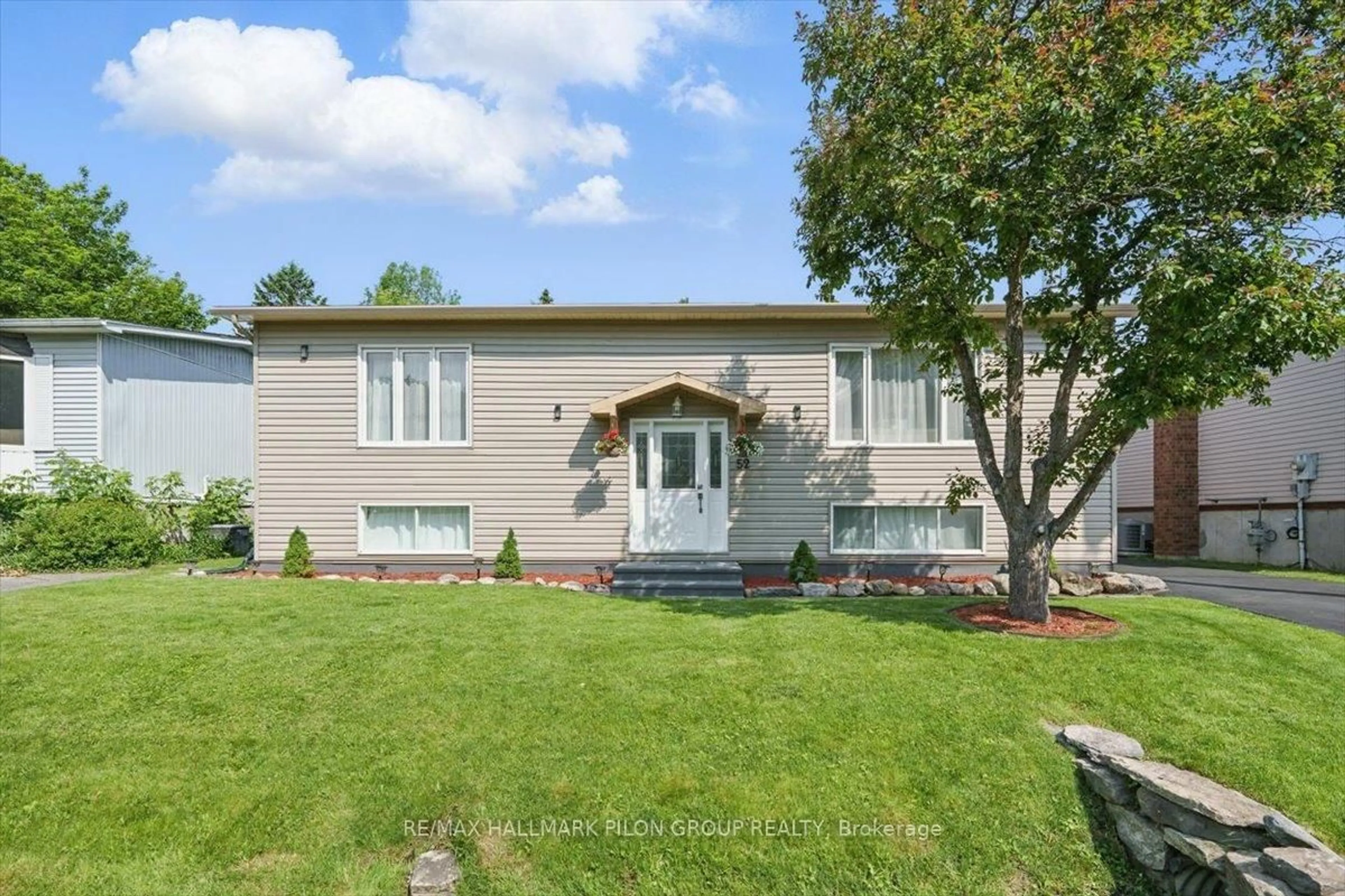 Home with vinyl exterior material, street for 52 Poole Creek Cres, Ottawa Ontario K2S 1T7