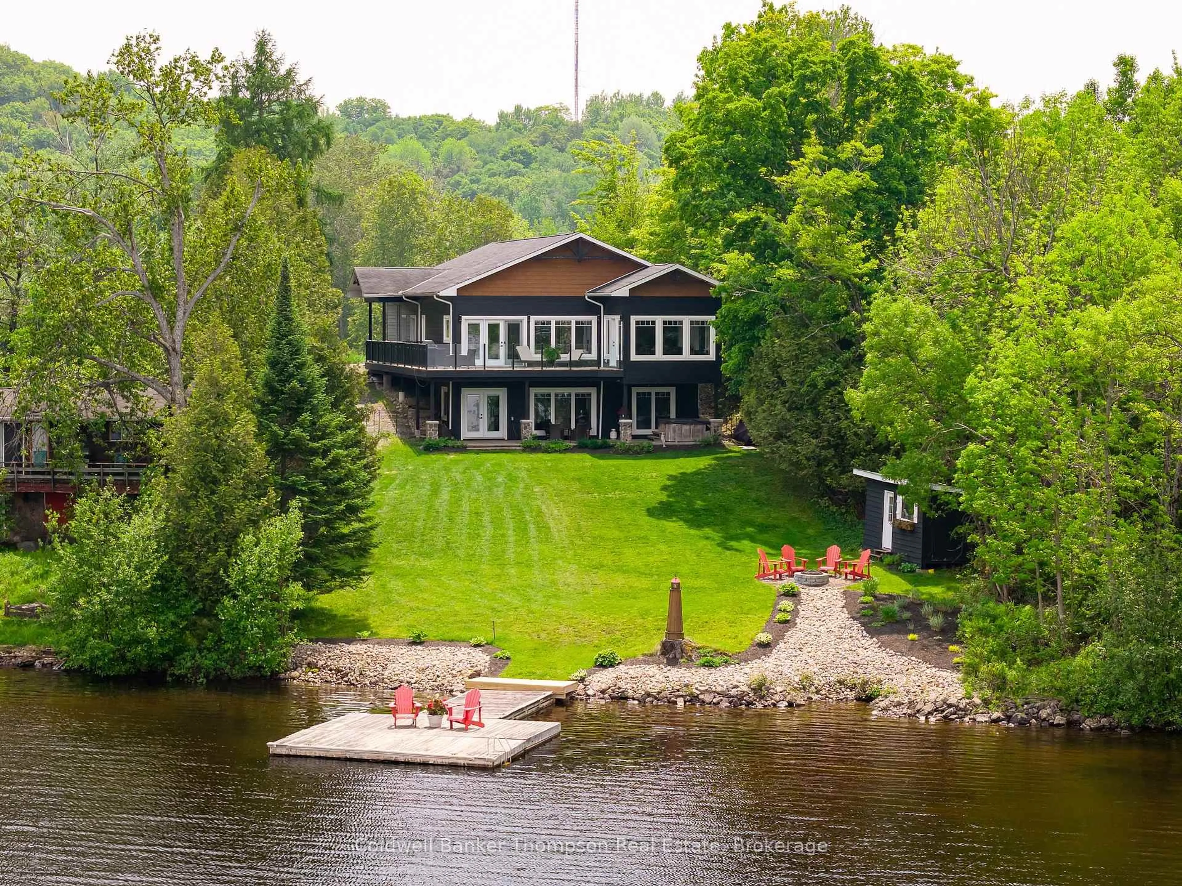 A pic from outside/outdoor area/front of a property/back of a property/a pic from drone, water/lake/river/ocean view for 150 Lighthouse Point Rd, Huntsville Ontario P1H 1Y7