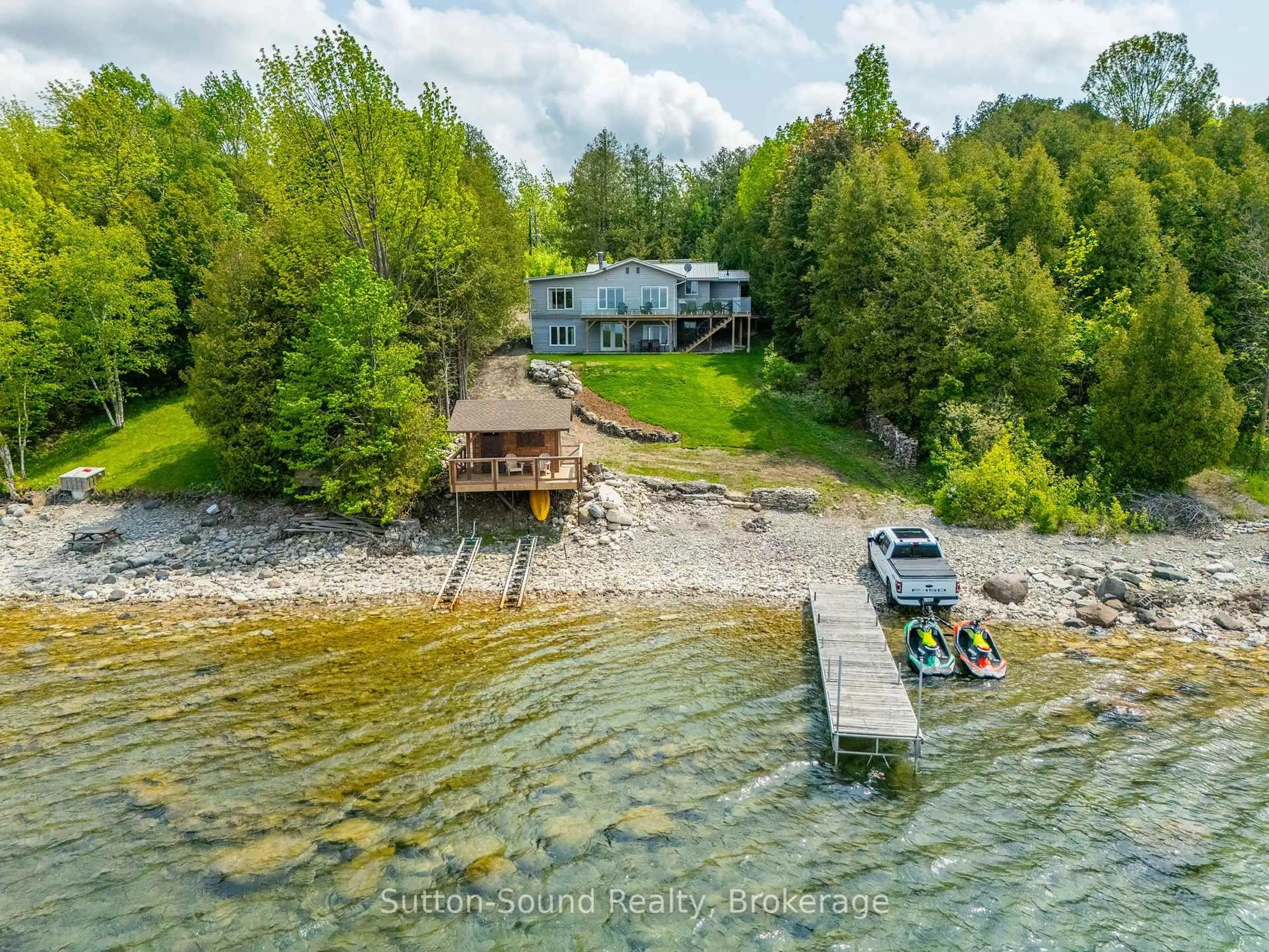 A pic from outside/outdoor area/front of a property/back of a property/a pic from drone, water/lake/river/ocean view for 503185 Grey Road 1 Rd, Georgian Bluffs Ontario N0H 2T0