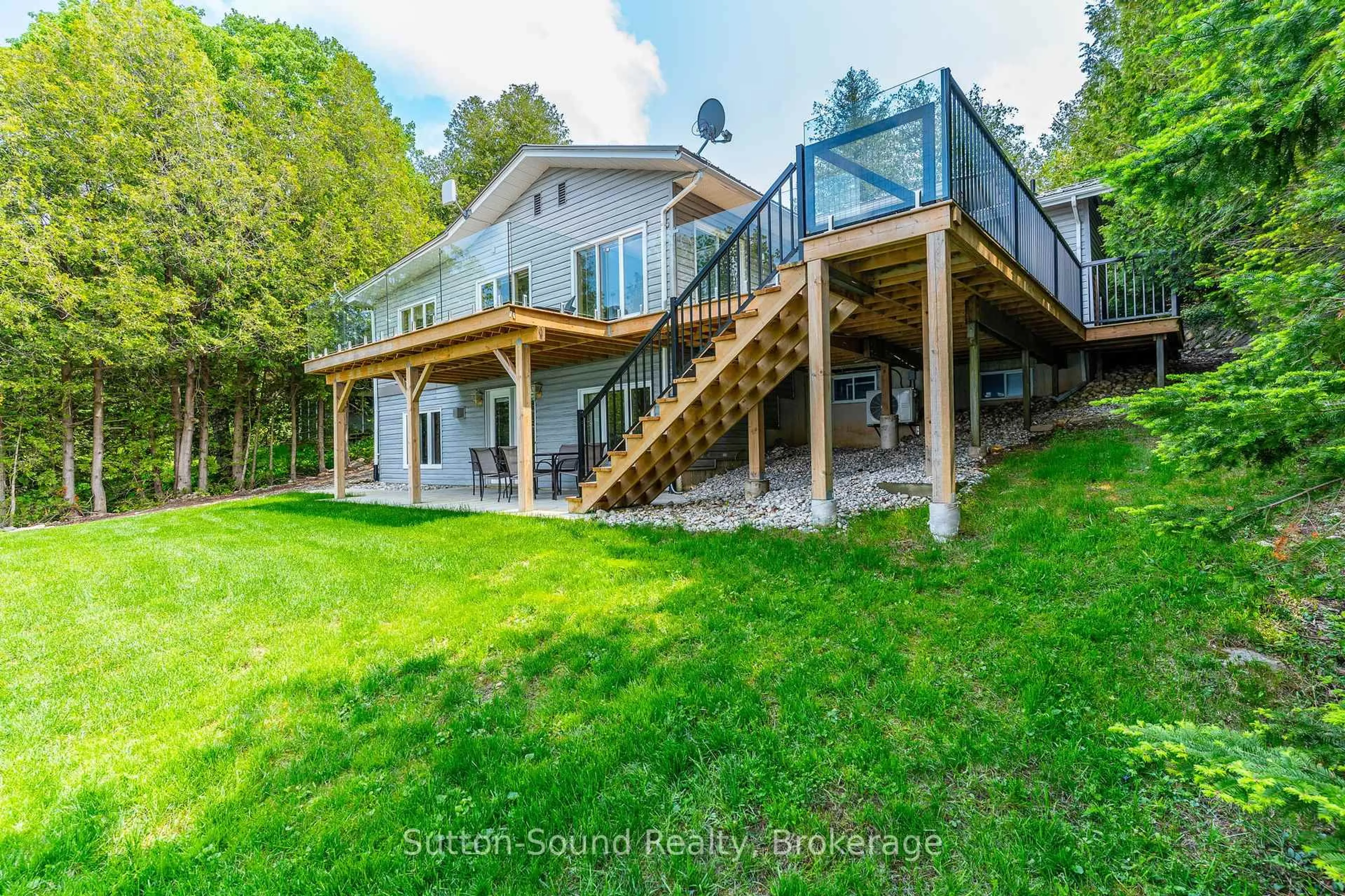 A pic from outside/outdoor area/front of a property/back of a property/a pic from drone, water/lake/river/ocean view for 503185 Grey Road 1 Rd, Georgian Bluffs Ontario N0H 2T0