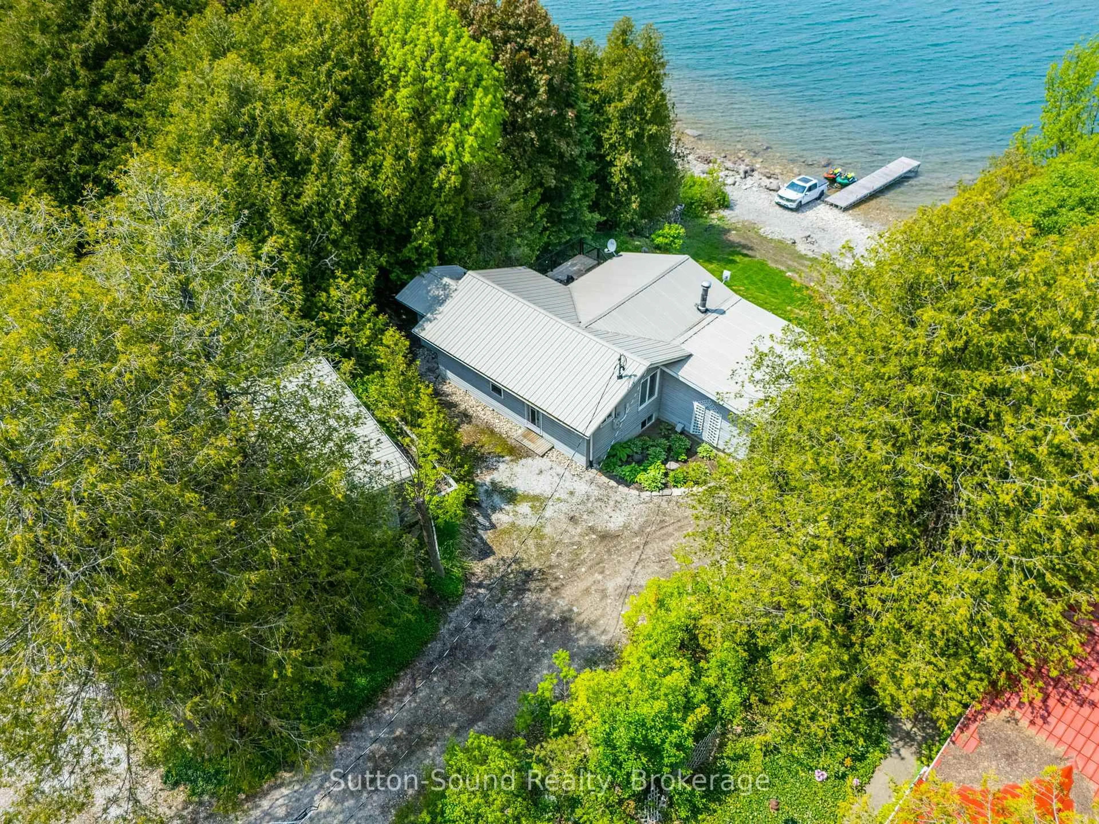 A pic from outside/outdoor area/front of a property/back of a property/a pic from drone, water/lake/river/ocean view for 503185 Grey Road 1 Rd, Georgian Bluffs Ontario N0H 2T0