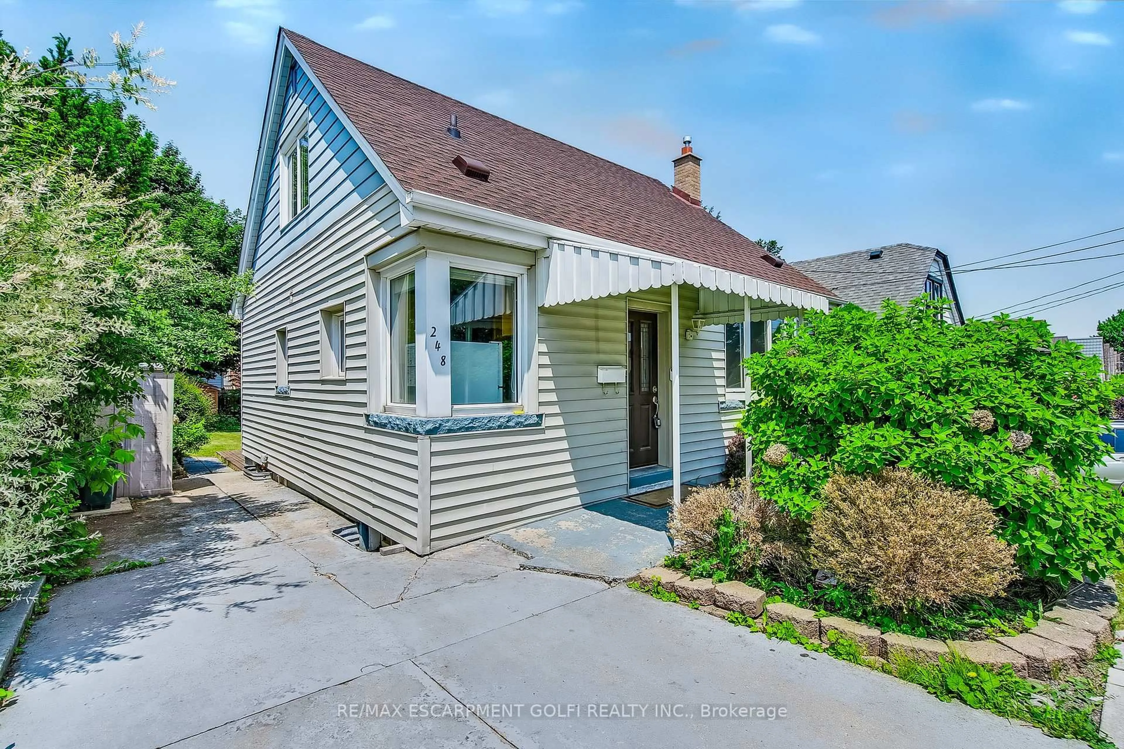 Home with vinyl exterior material, street for 248 Glenholme Ave, Hamilton Ontario L8K 3L8