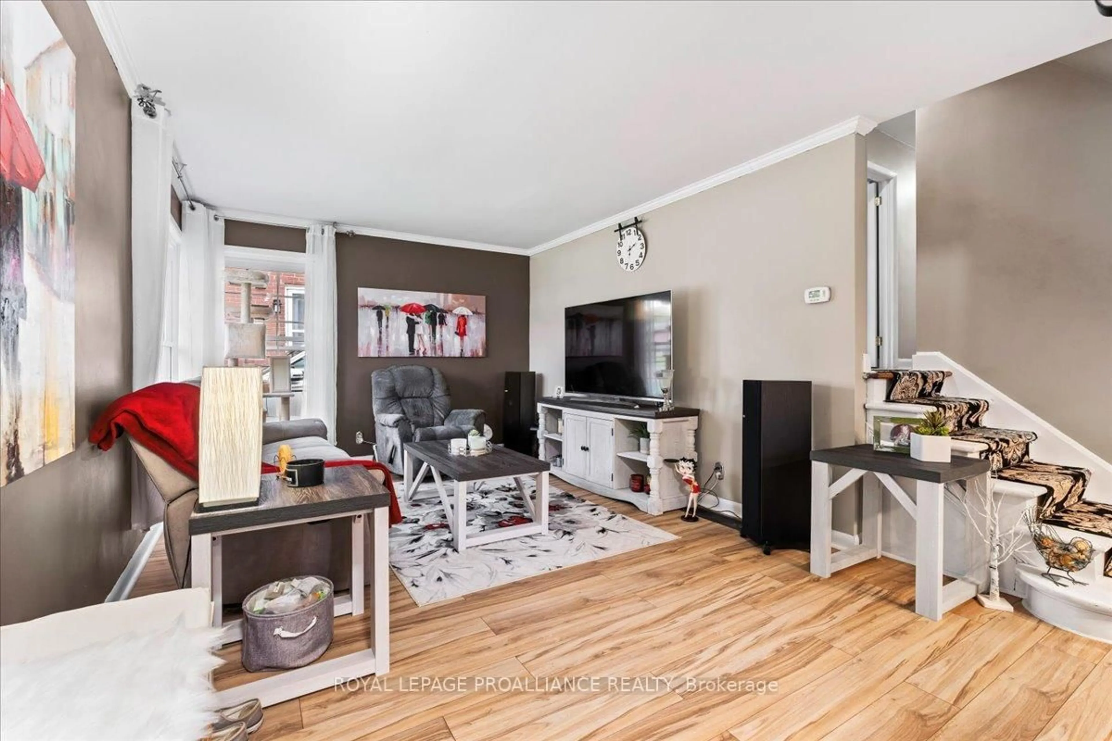Living room with furniture, wood/laminate floor for 23 Alfred Dr, Belleville Ontario K8N 4M6