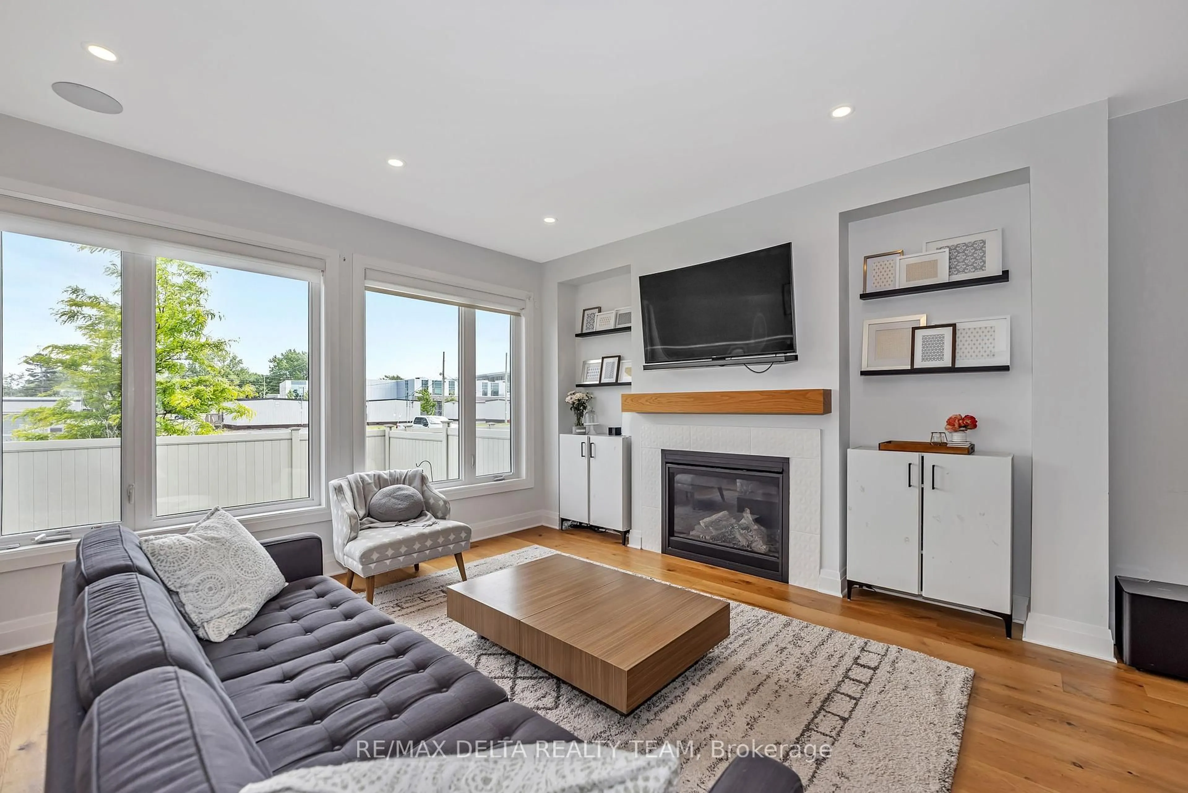 Living room with furniture, wood/laminate floor for 128 Crevasse Rd, Ottawa Ontario K1W 0P9