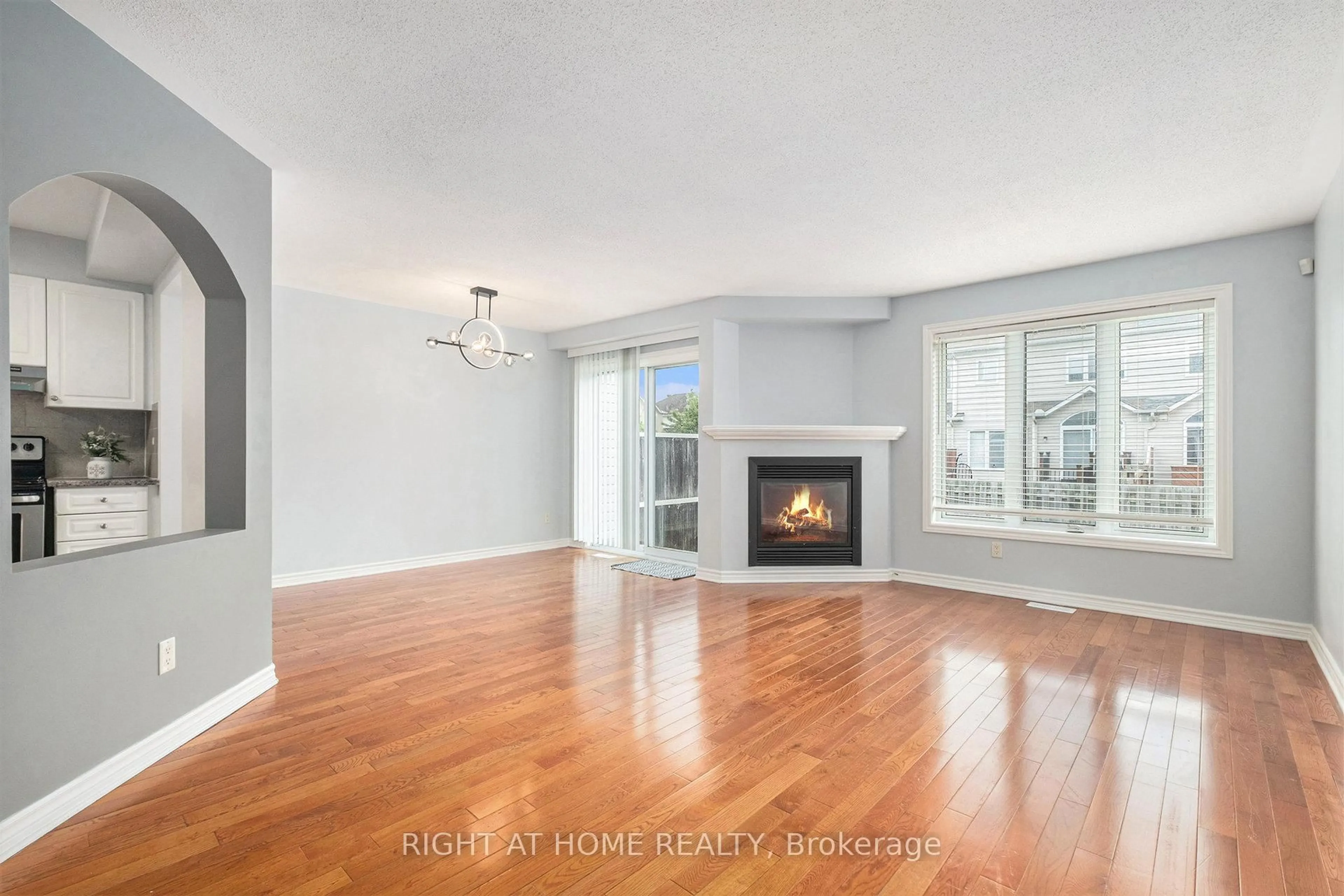 Living room with furniture, wood/laminate floor for 352 Selene Way, Ottawa Ontario K4A 0G6