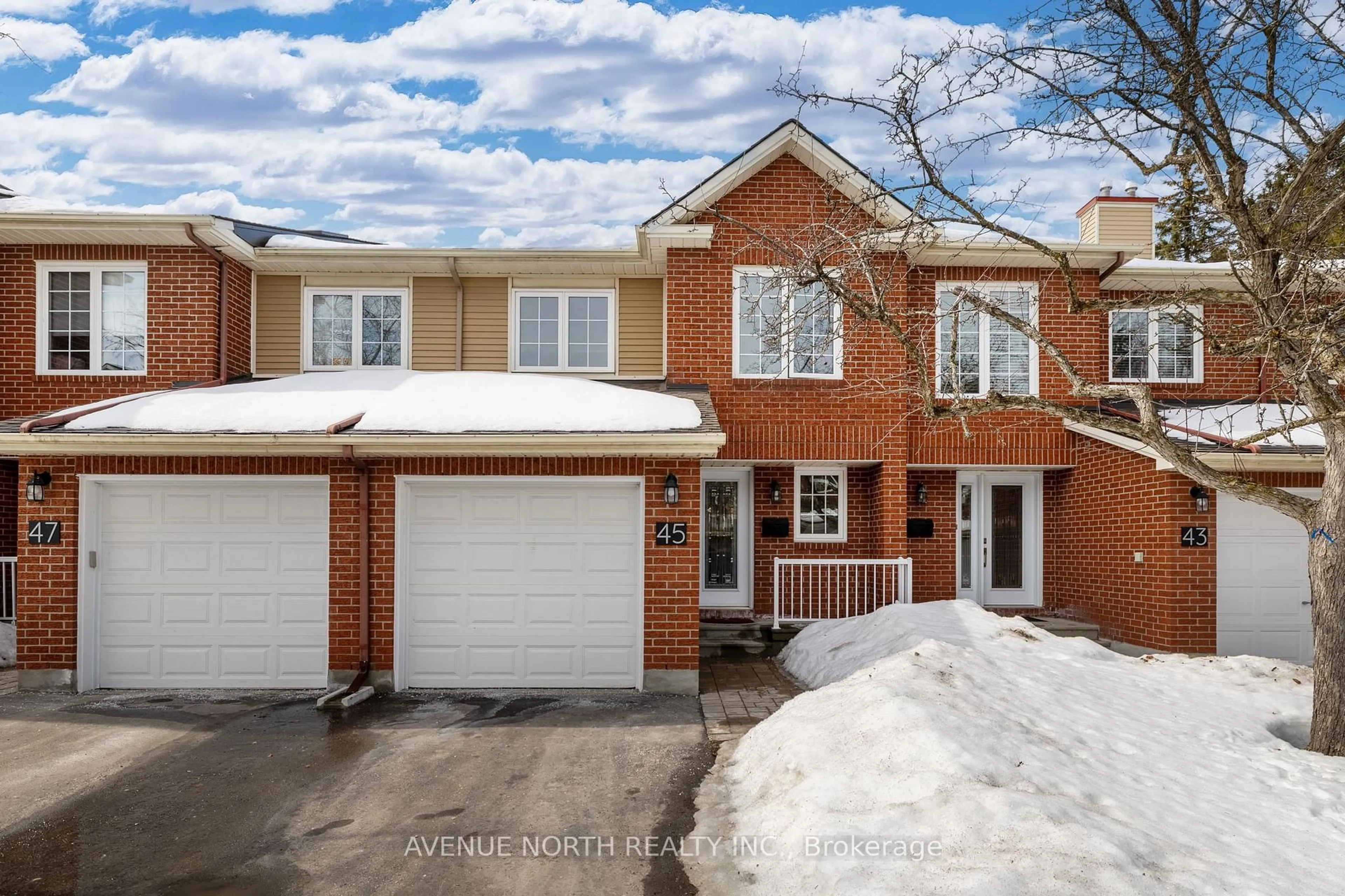 Home with brick exterior material, street for 45 Wrenwood Cres #23, Ottawa Ontario K2G 5V4