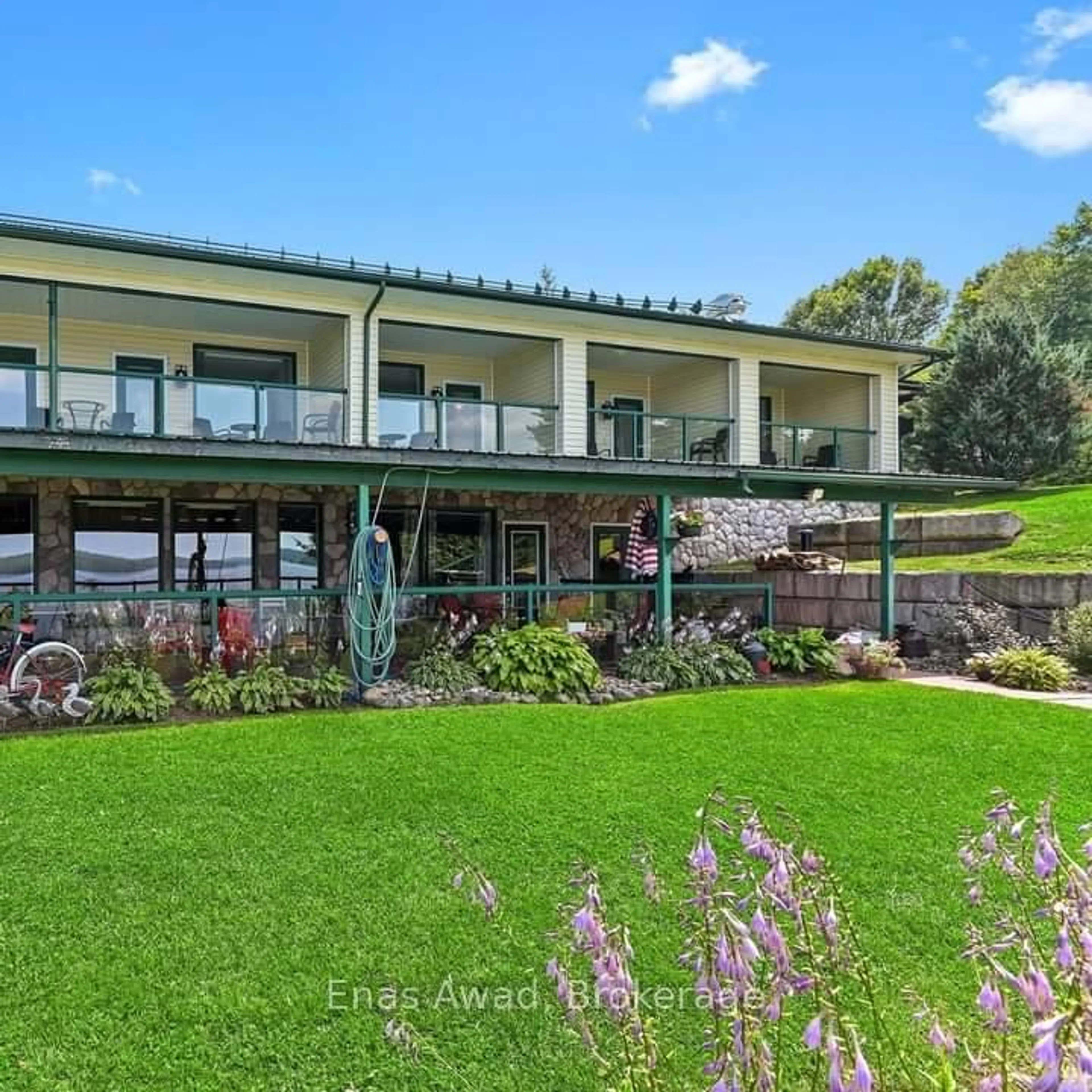 A pic from outside/outdoor area/front of a property/back of a property/a pic from drone, water/lake/river/ocean view for 188 Village St, Bancroft Ontario K0L 1C0