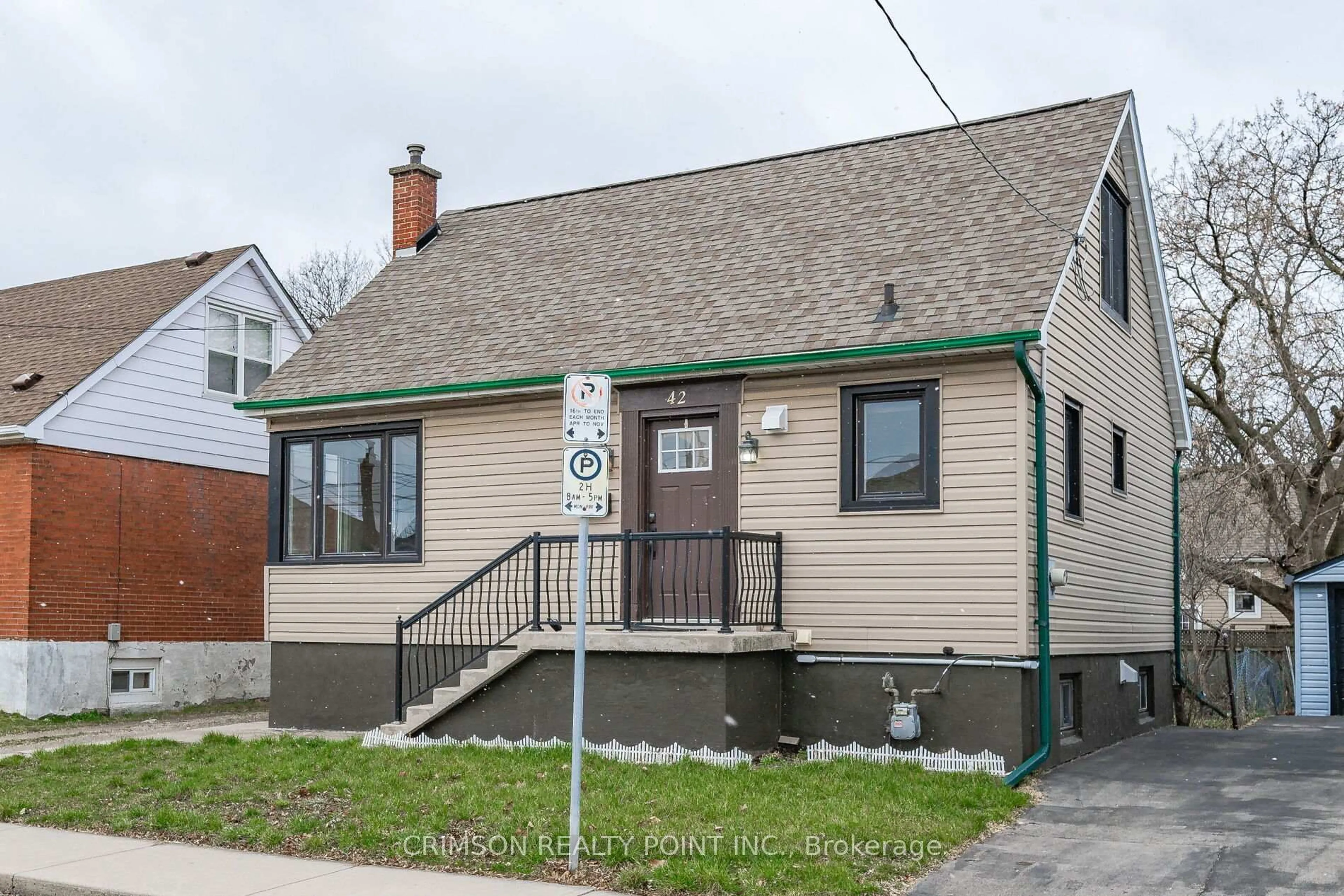 Home with vinyl exterior material, street for 42 East 11th St, Hamilton Ontario L9A 3T2