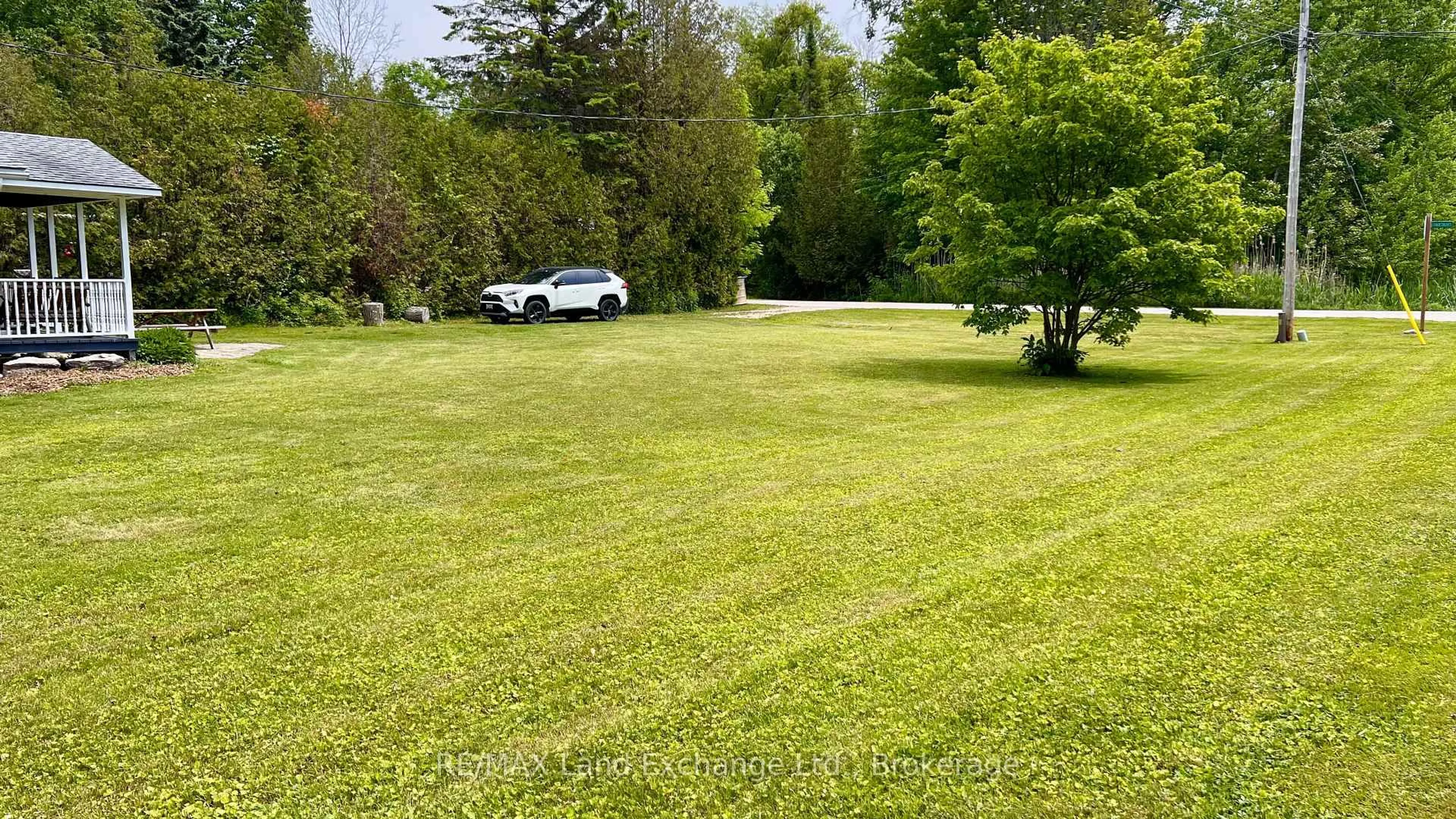 A pic from outside/outdoor area/front of a property/back of a property/a pic from drone, forest/trees view for 401 Oki Crt, Huron-Kinloss Ontario N2Z 2X3