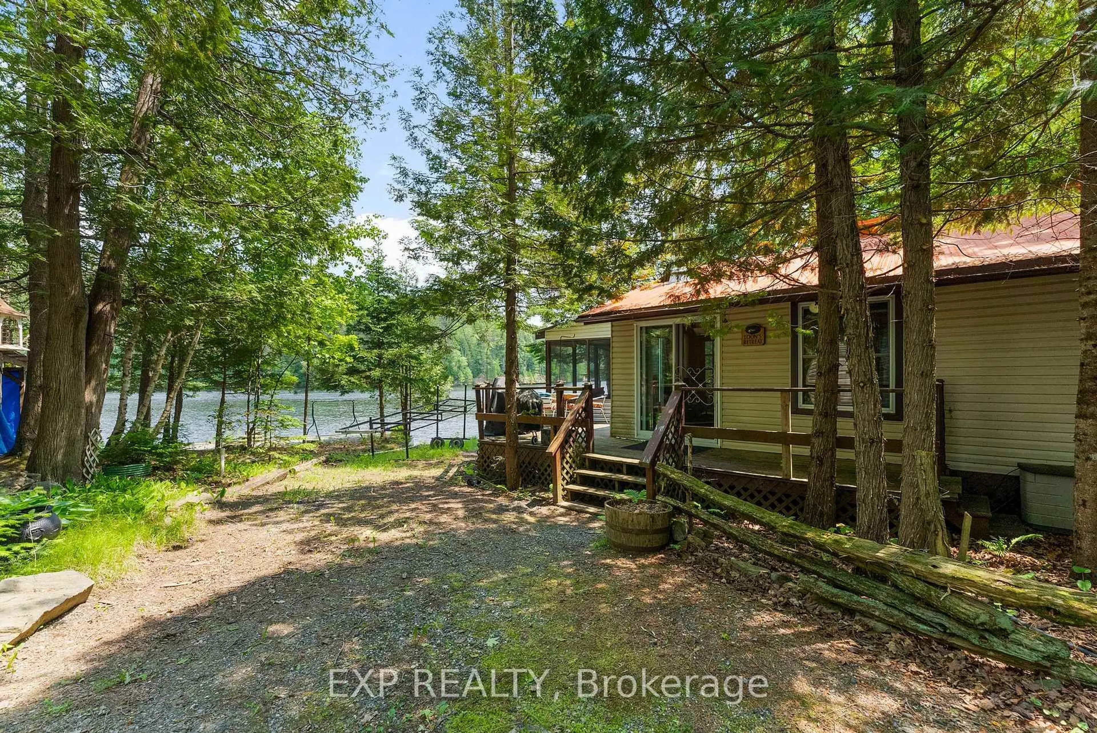 A pic from outside/outdoor area/front of a property/back of a property/a pic from drone, water/lake/river/ocean view for 1061-A Centennial Lake Rd, Calabogie Ontario K0J 1H0