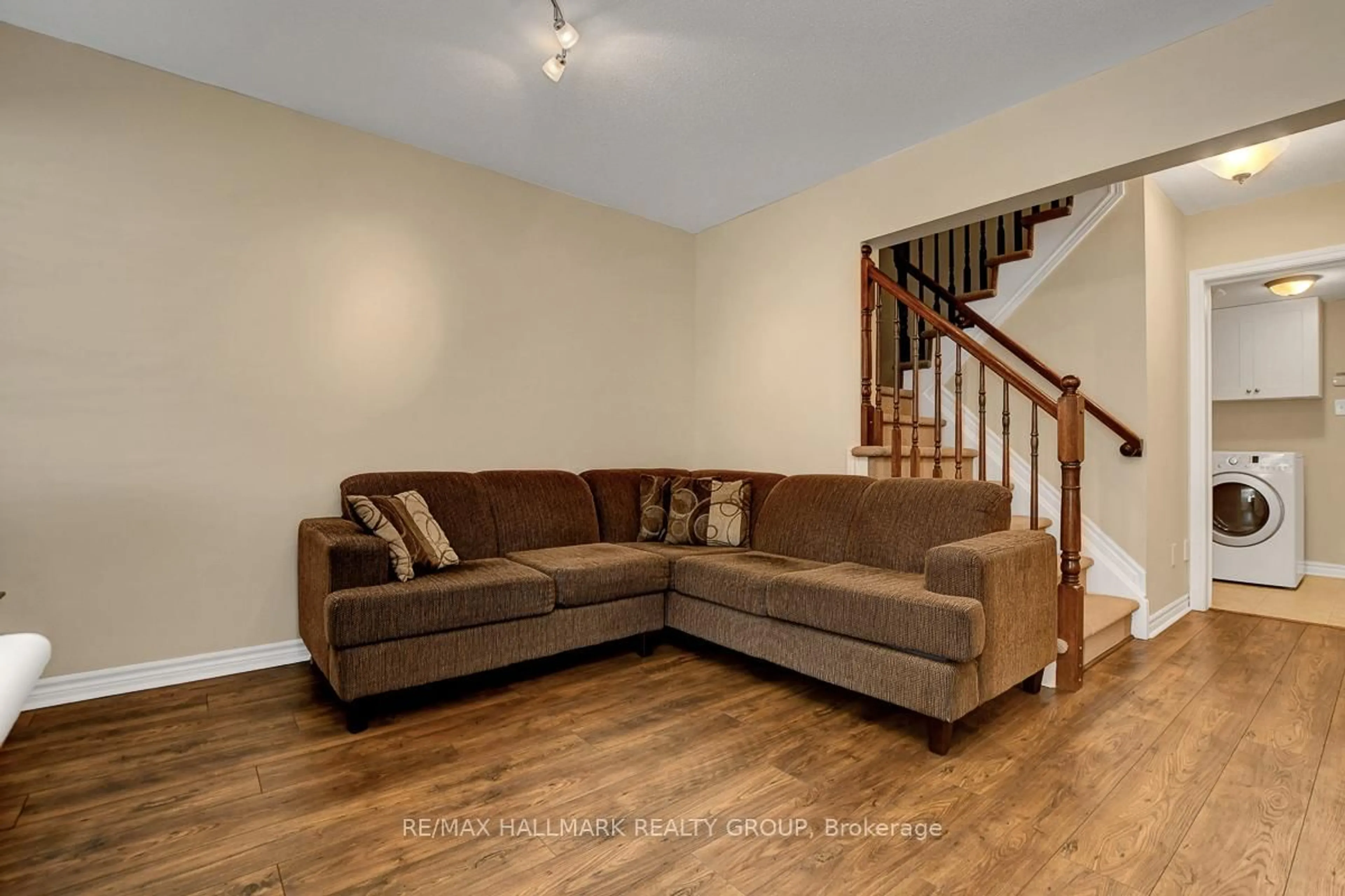 Living room with furniture, wood/laminate floor for 2071 Madrid Ave, Ottawa Ontario K2J 0K4