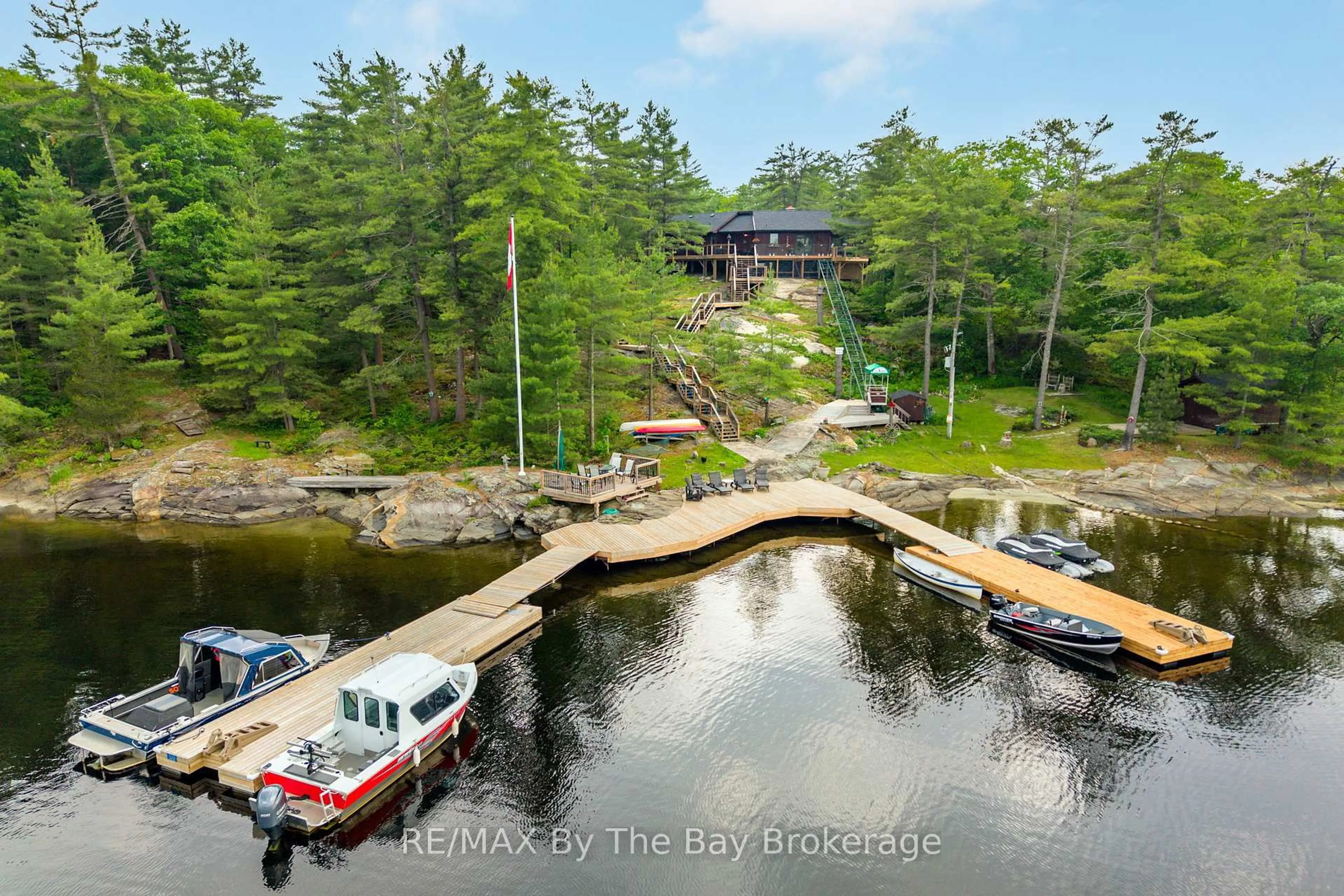 A pic from outside/outdoor area/front of a property/back of a property/a pic from drone, water/lake/river/ocean view for 3688 Is 1810, Bone Is, Georgian Bay Ontario P0E 1E0