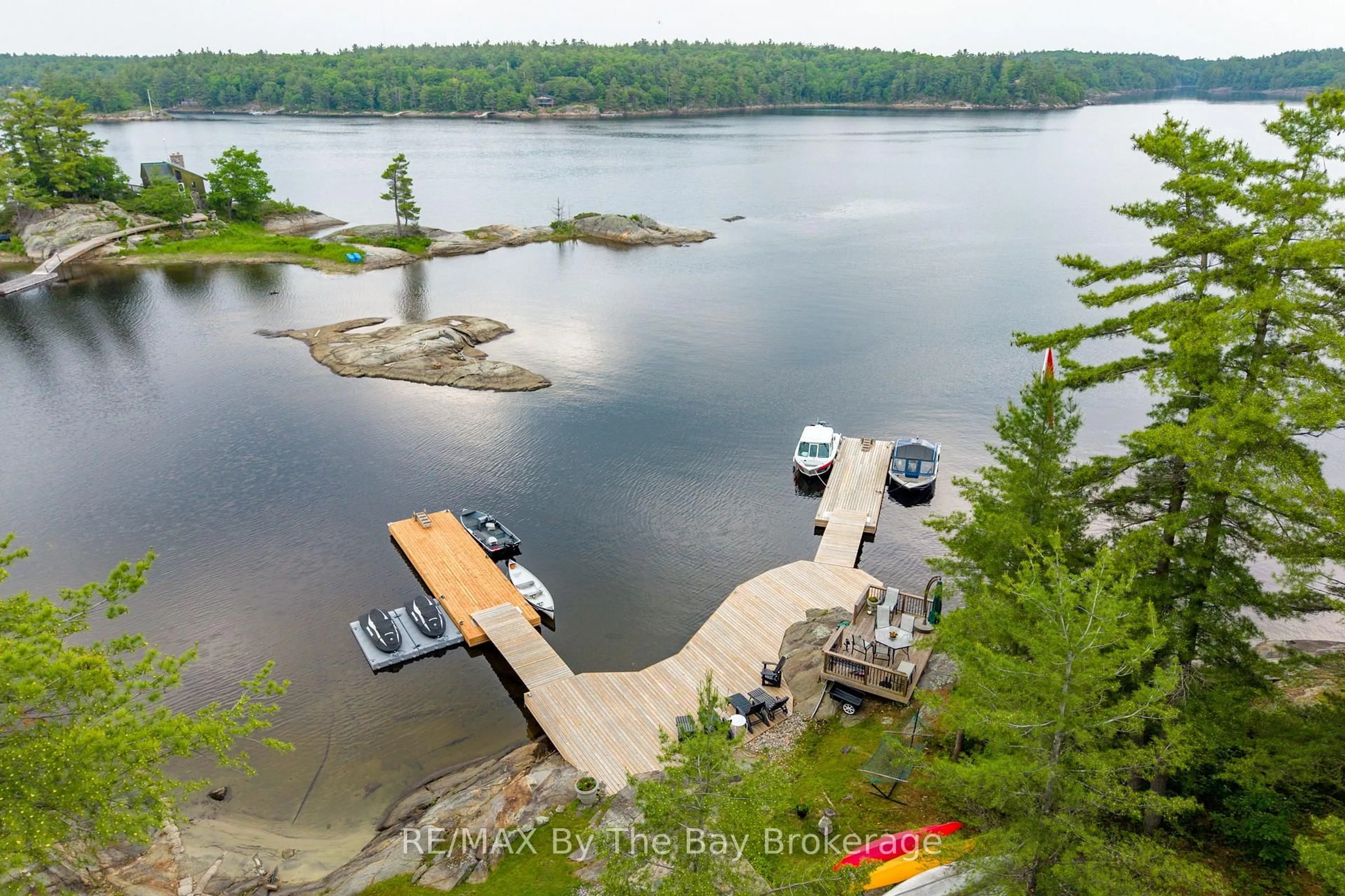 A pic from outside/outdoor area/front of a property/back of a property/a pic from drone, water/lake/river/ocean view for 3688 Is 1810, Bone Is, Georgian Bay Ontario P0E 1E0