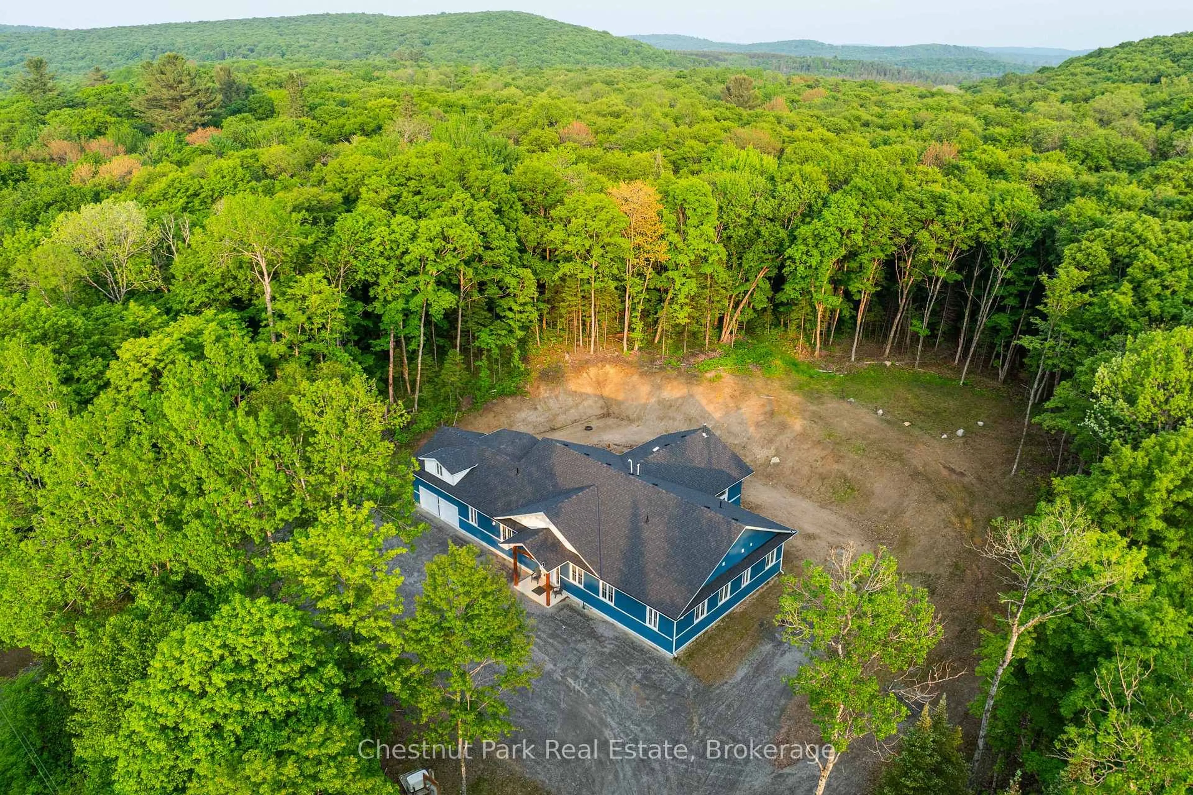 A pic from outside/outdoor area/front of a property/back of a property/a pic from drone, forest/trees view for 1153 Deer Lake Rd, Perry Ontario P0A 1Z0