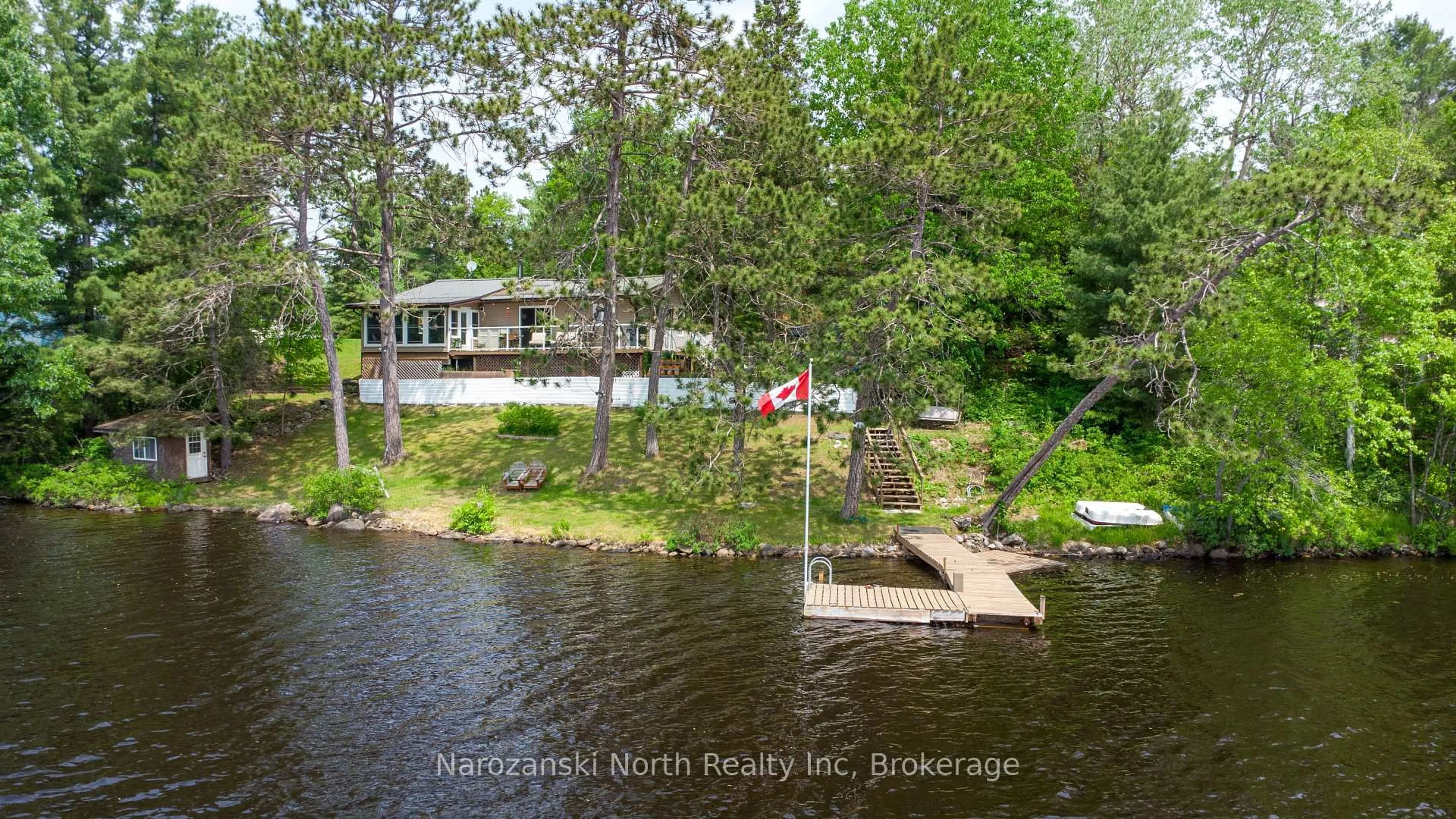 A pic from outside/outdoor area/front of a property/back of a property/a pic from drone, water/lake/river/ocean view for 1893 Musky Bay Rd, St. Charles Ontario P0M 2W0