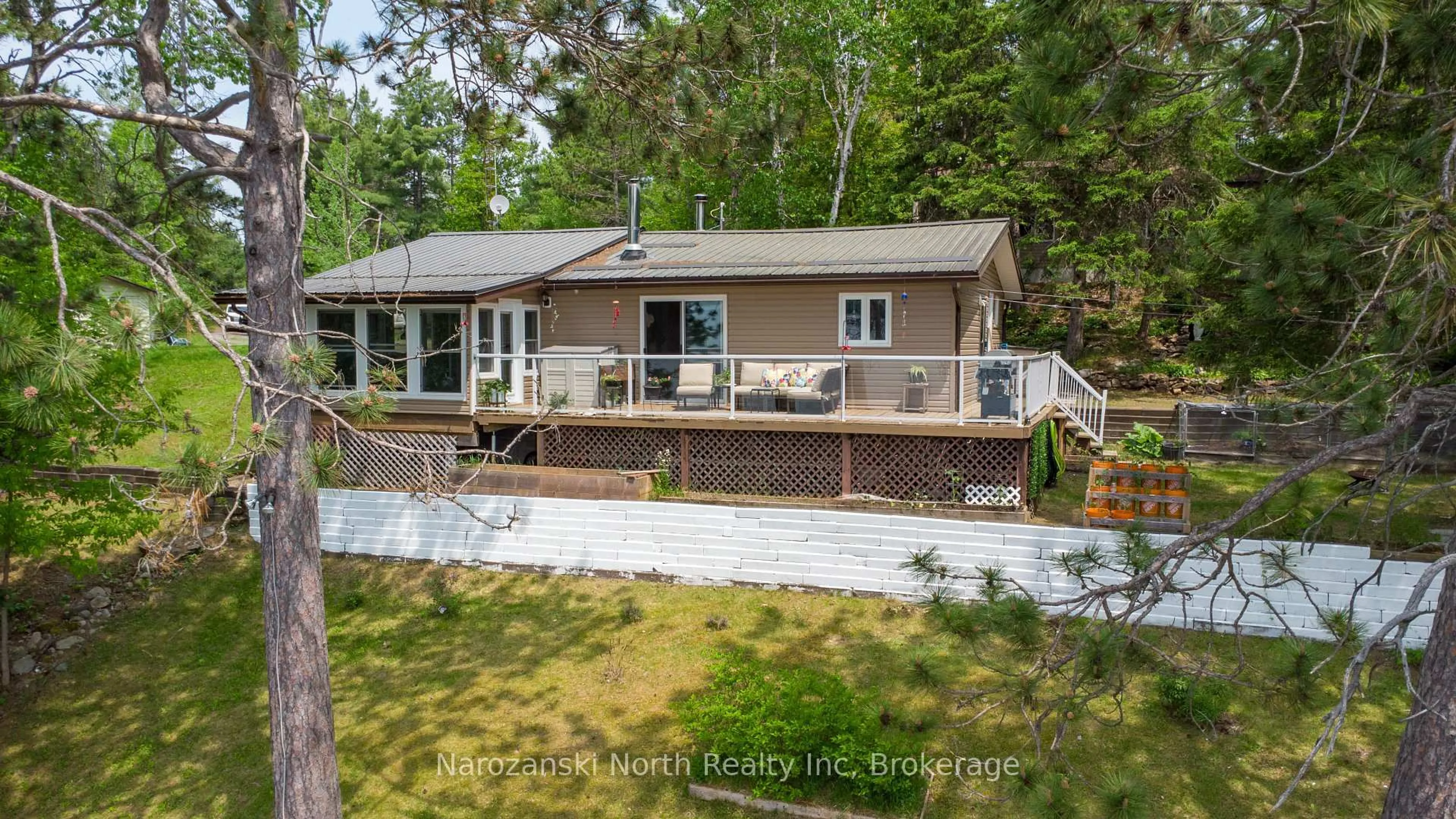 A pic from outside/outdoor area/front of a property/back of a property/a pic from drone, water/lake/river/ocean view for 1893 Musky Bay Rd, St. Charles Ontario P0M 2W0
