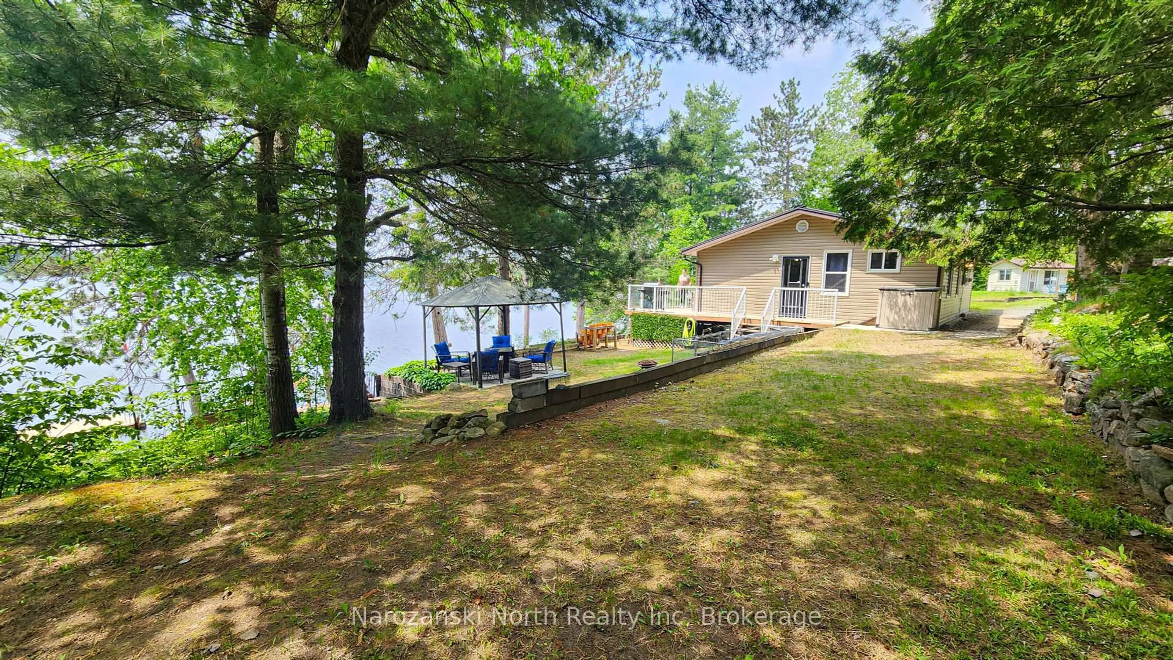 A pic from outside/outdoor area/front of a property/back of a property/a pic from drone, water/lake/river/ocean view for 1893 Musky Bay Rd, St. Charles Ontario P0M 2W0