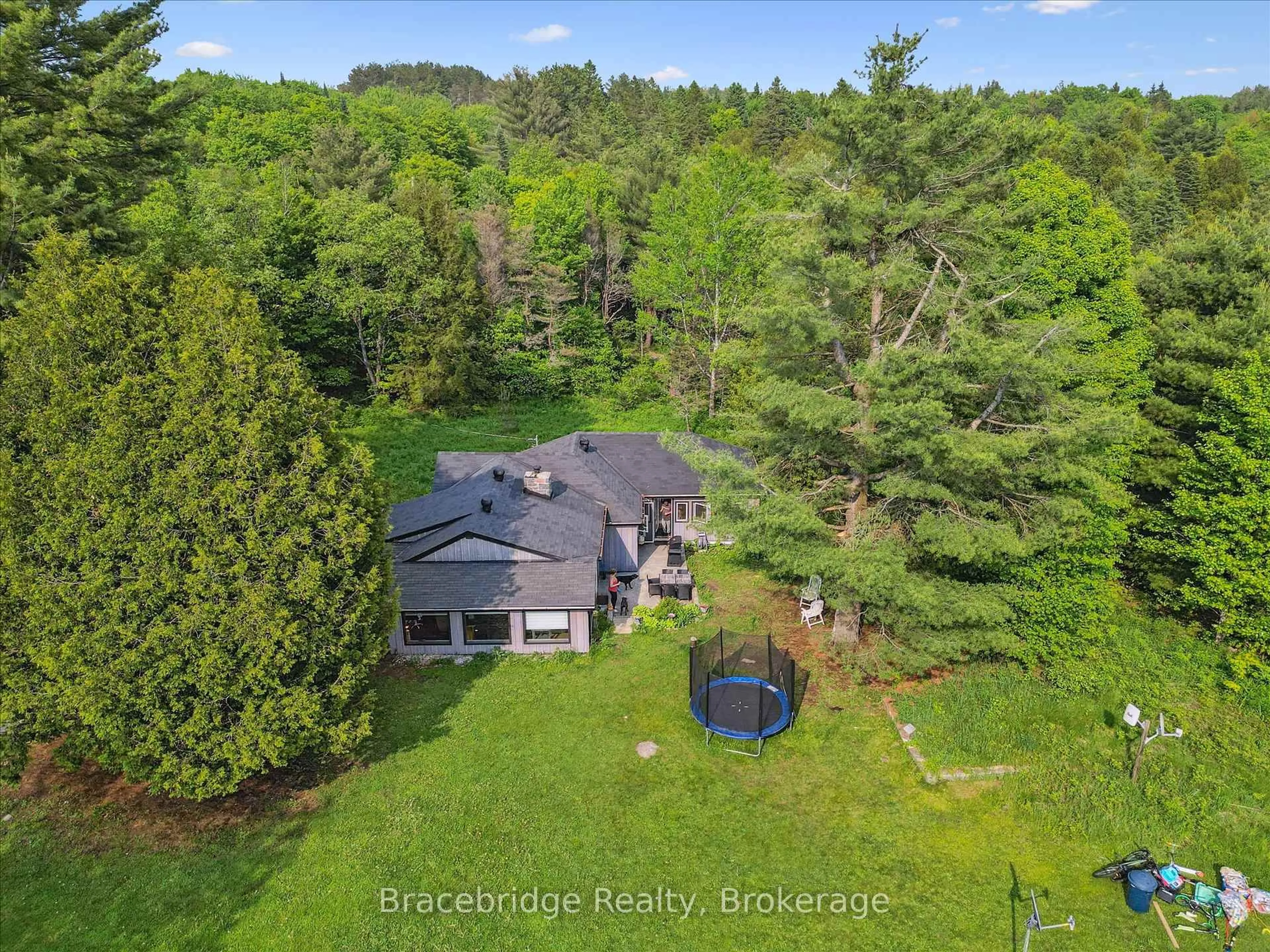 A pic from outside/outdoor area/front of a property/back of a property/a pic from drone, water/lake/river/ocean view for 1151 Beatrice Town Line, Bracebridge Ontario P1L 1X4