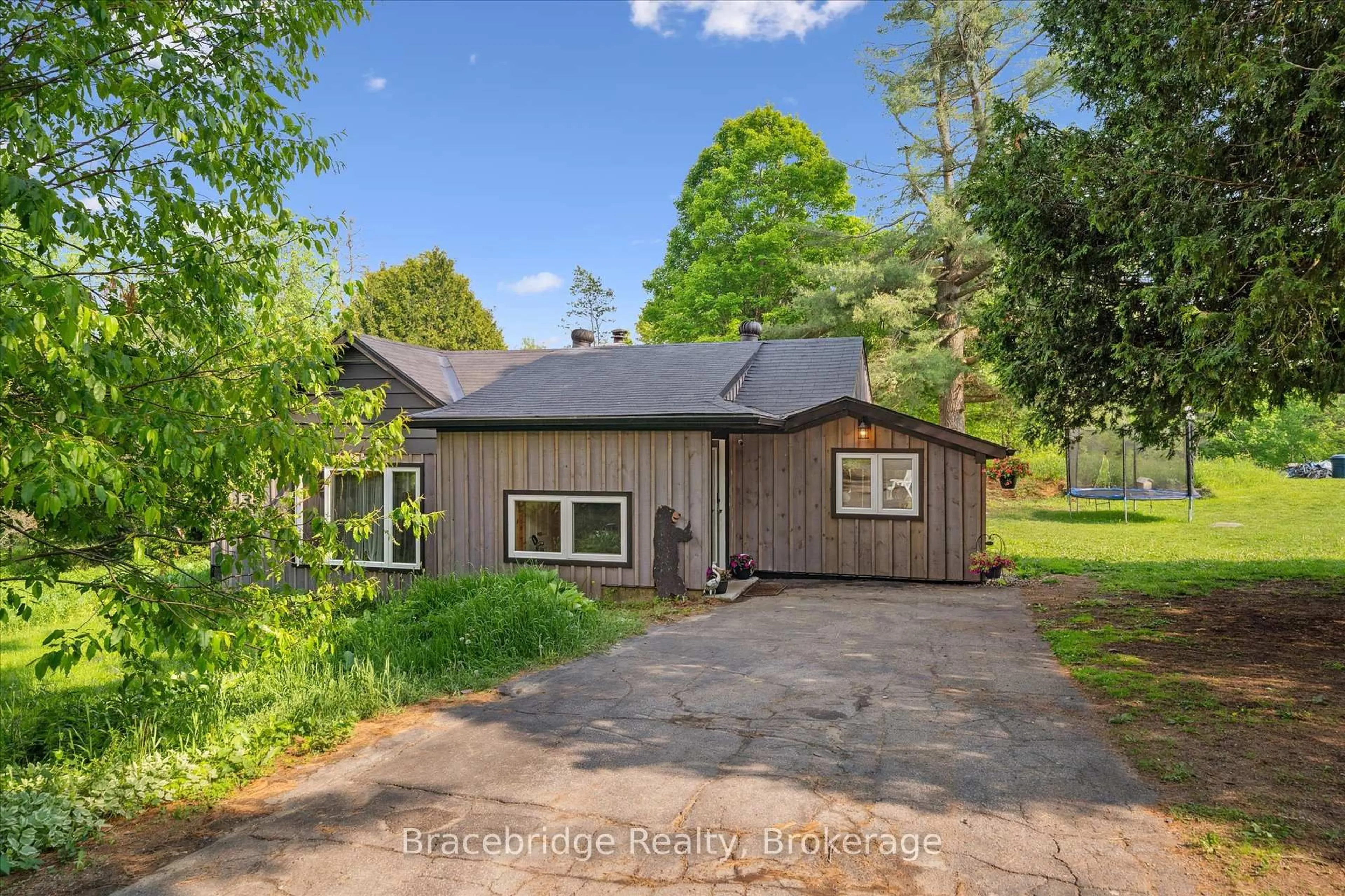 A pic from outside/outdoor area/front of a property/back of a property/a pic from drone, street for 1151 Beatrice Town Line, Bracebridge Ontario P1L 1X4