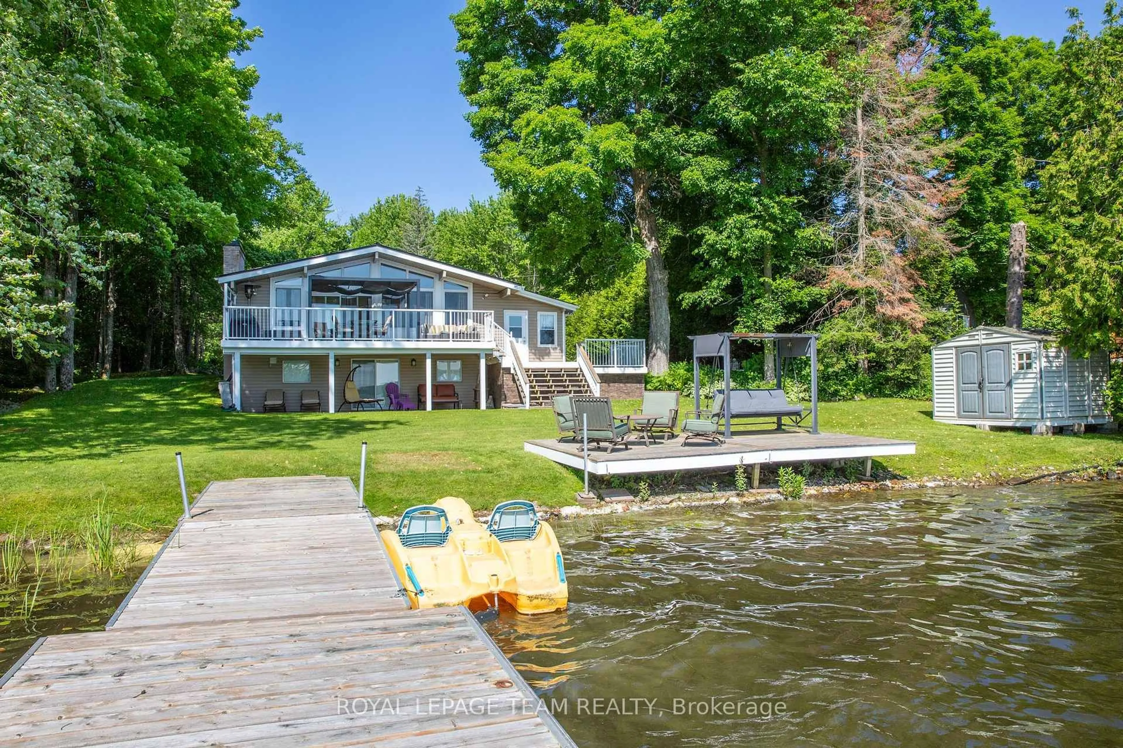 A pic from outside/outdoor area/front of a property/back of a property/a pic from drone, water/lake/river/ocean view for 1410 Wagner Rd, Sharbot Lake Ontario K0H 2P0