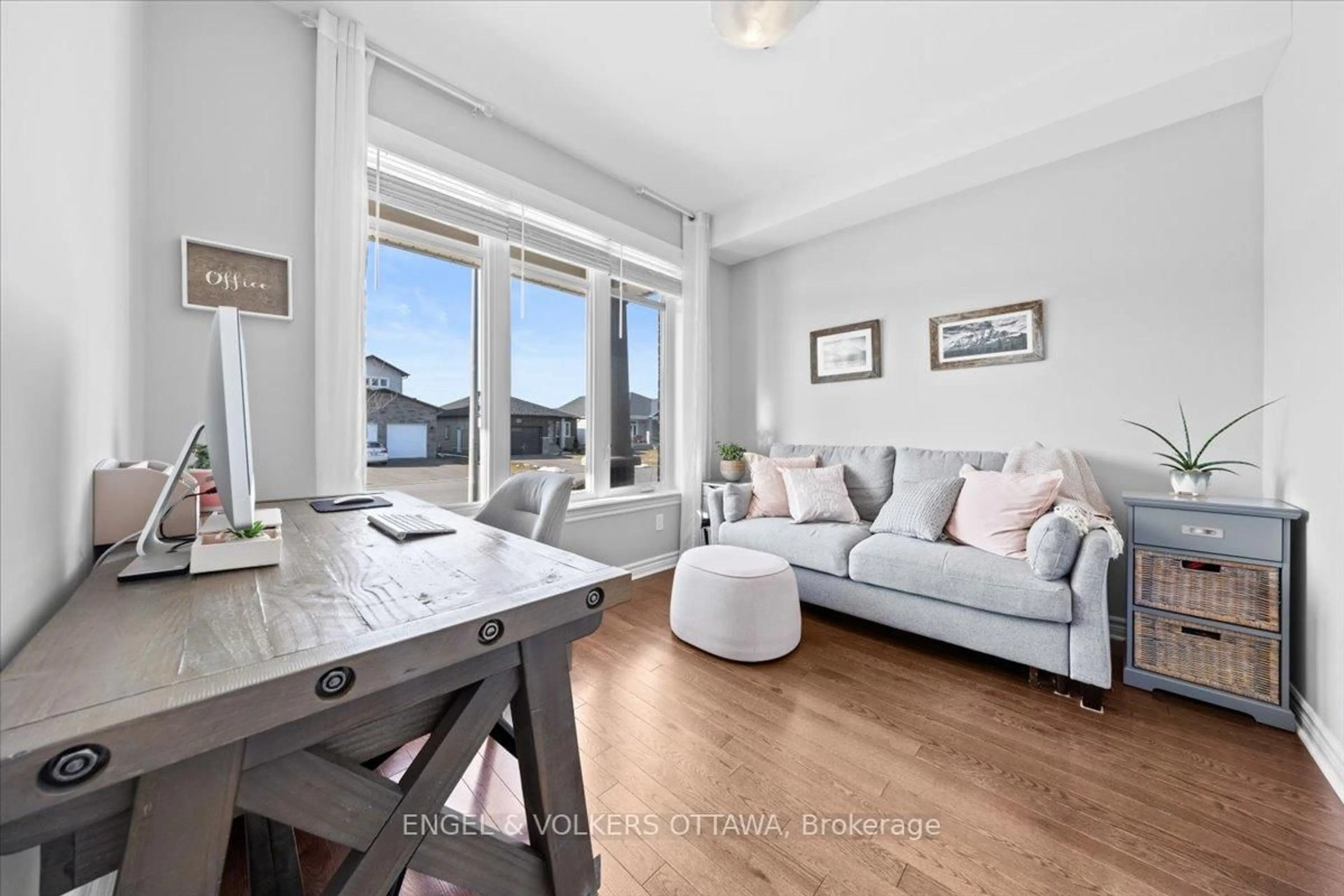 Living room with furniture, wood/laminate floor for 202 Pioneer Rd, Russell Ontario K4R 0E1