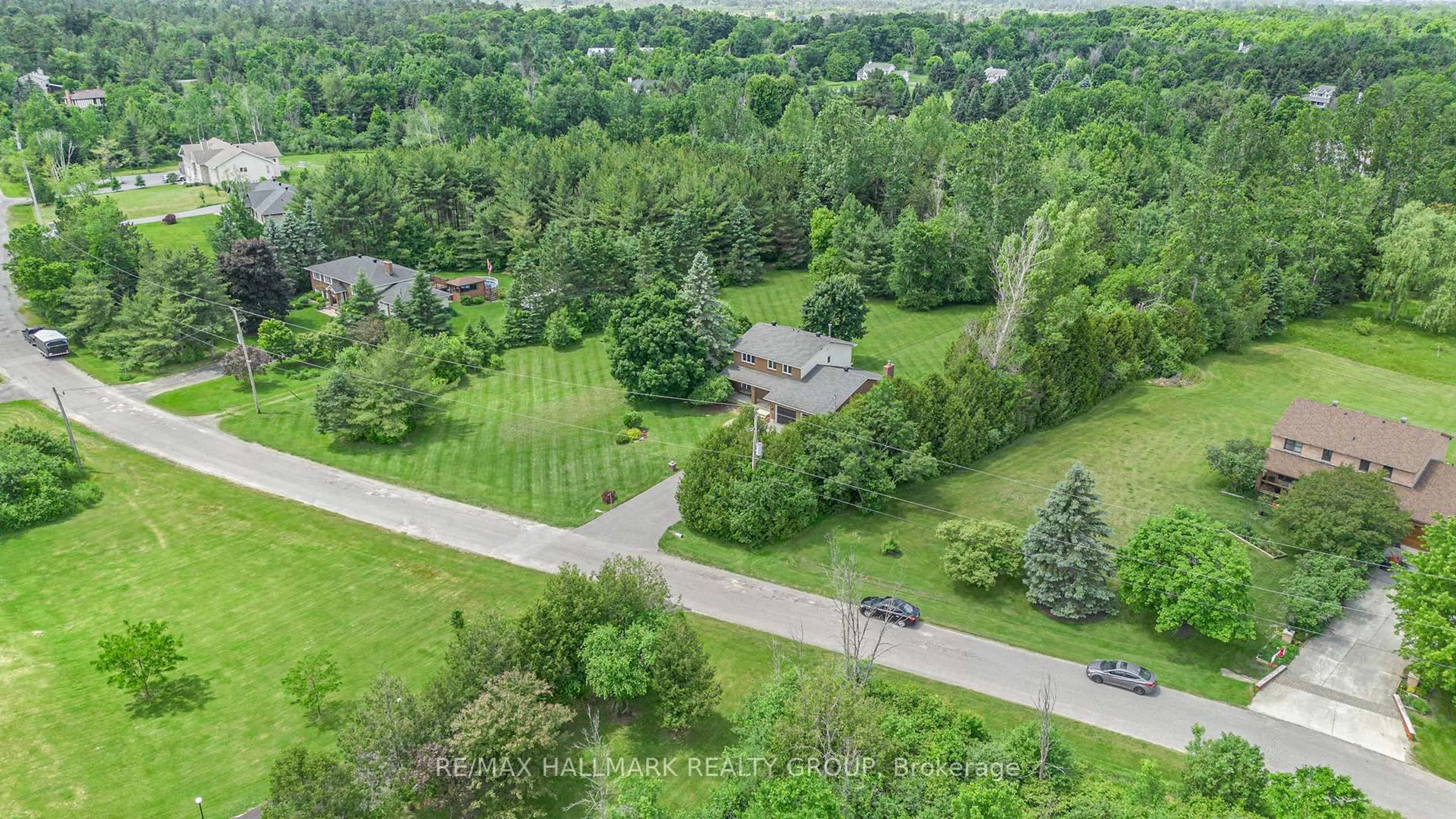 A pic from outside/outdoor area/front of a property/back of a property/a pic from drone, forest/trees view for 34 Grierson Lane, Ottawa Ontario K2W 1A6