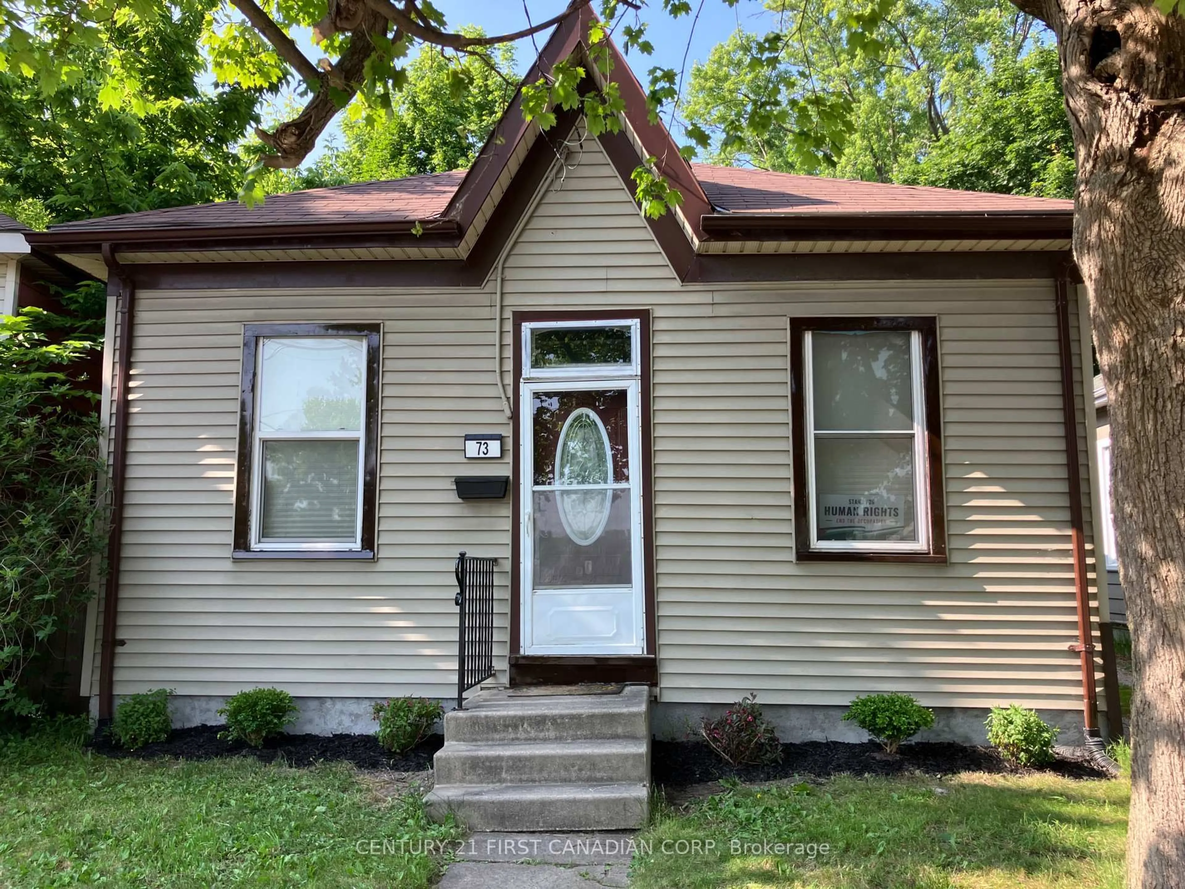 Home with vinyl exterior material, street for 73 Riverside Dr, London North Ontario N6H 1B3