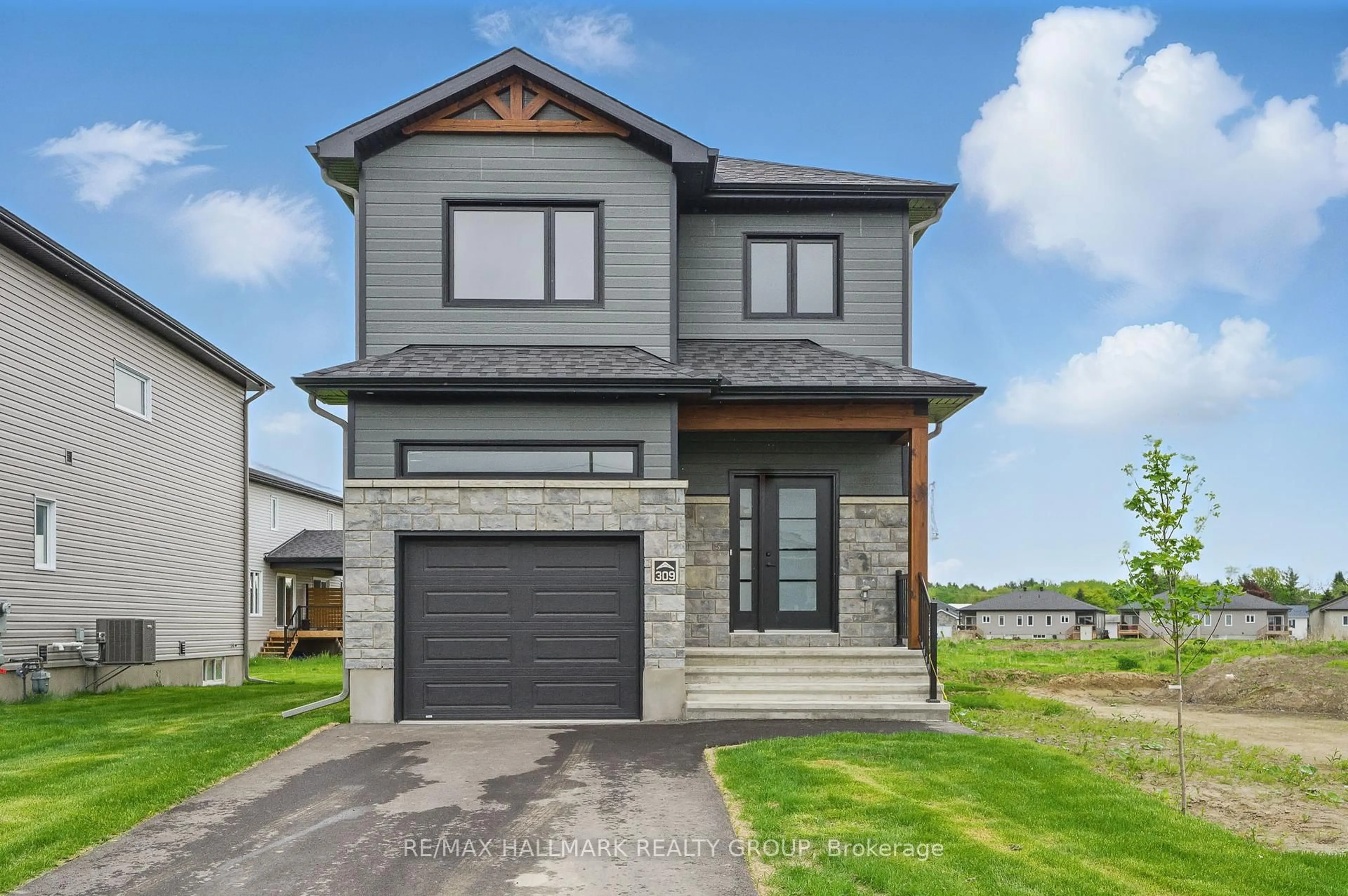 Home with brick exterior material, street for 319 Zakari St, Casselman Ontario K0A 1M0