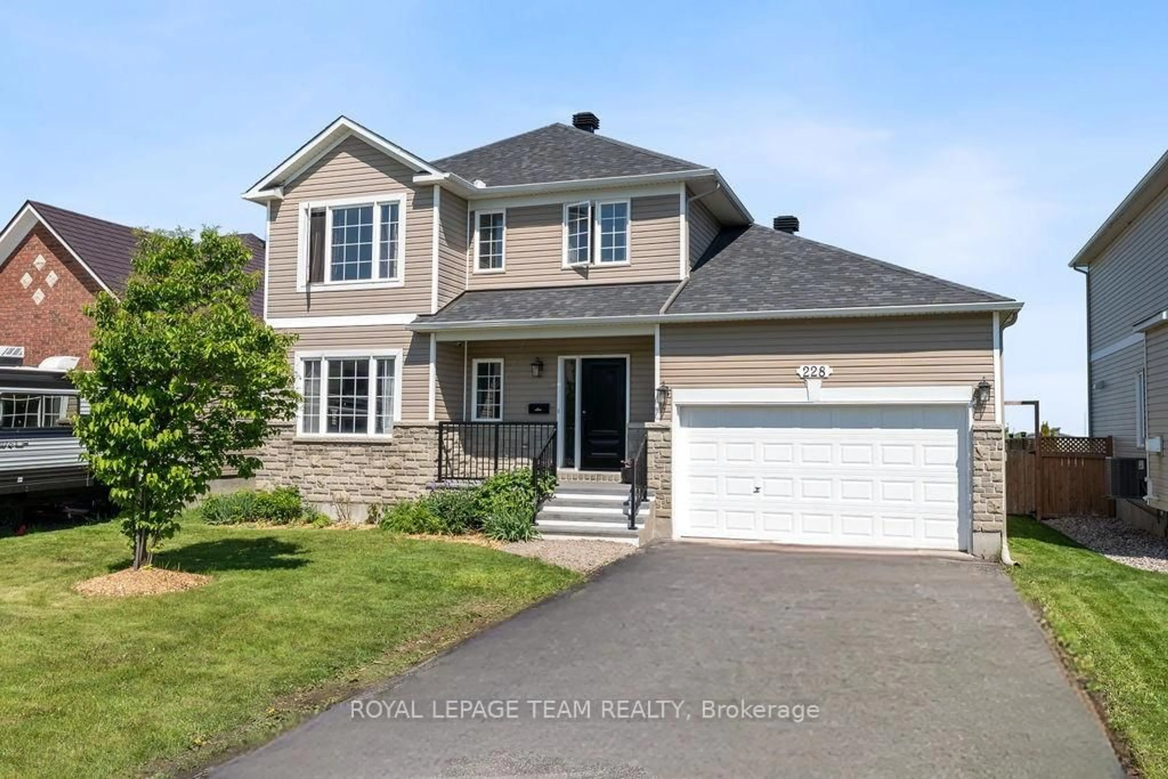 Home with vinyl exterior material, street for 228 Labelle St, Russell Ontario K0A 1W1
