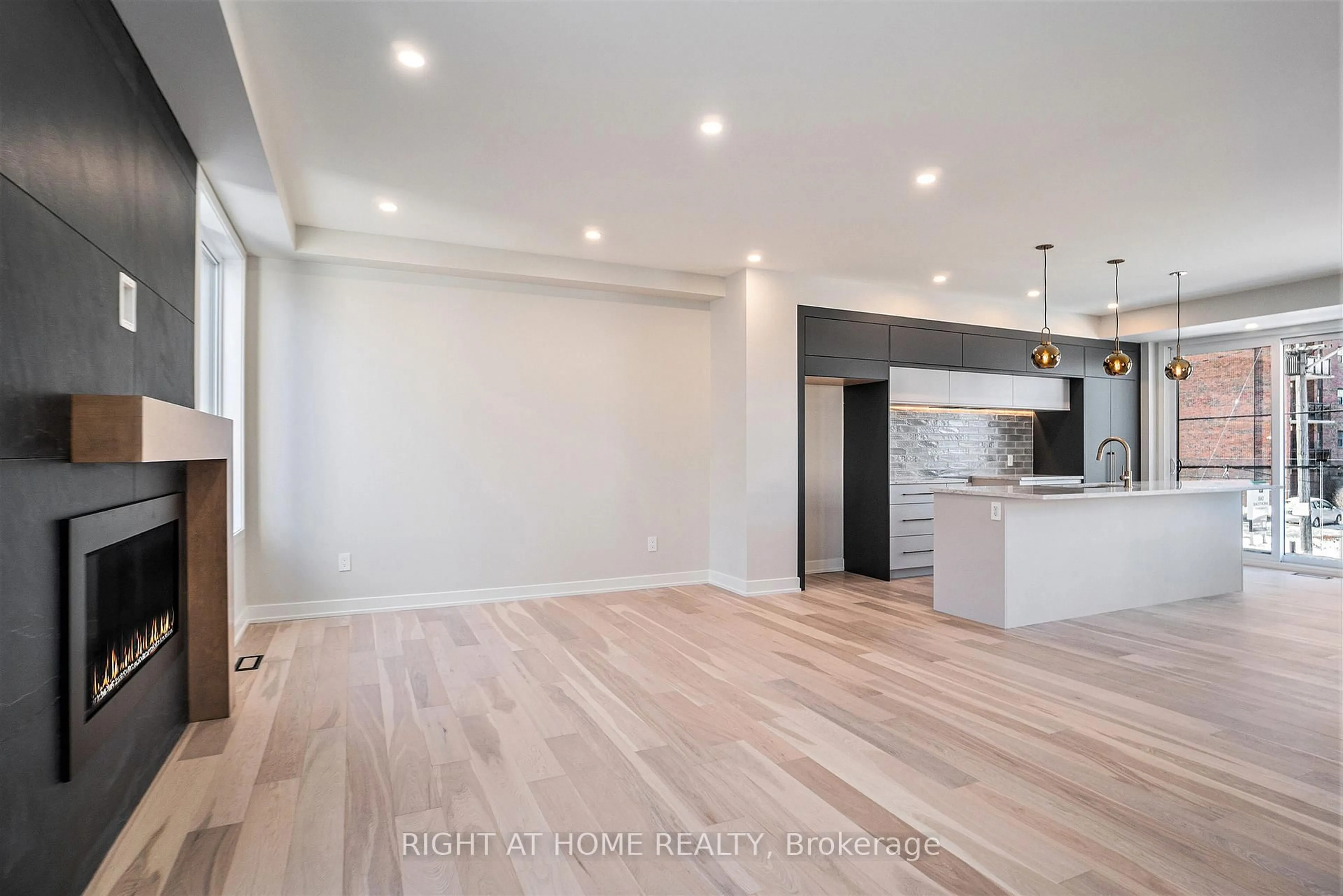Open concept kitchen, wood/laminate floor for 581 Codd's Rd, Ottawa Ontario K1K 2G6