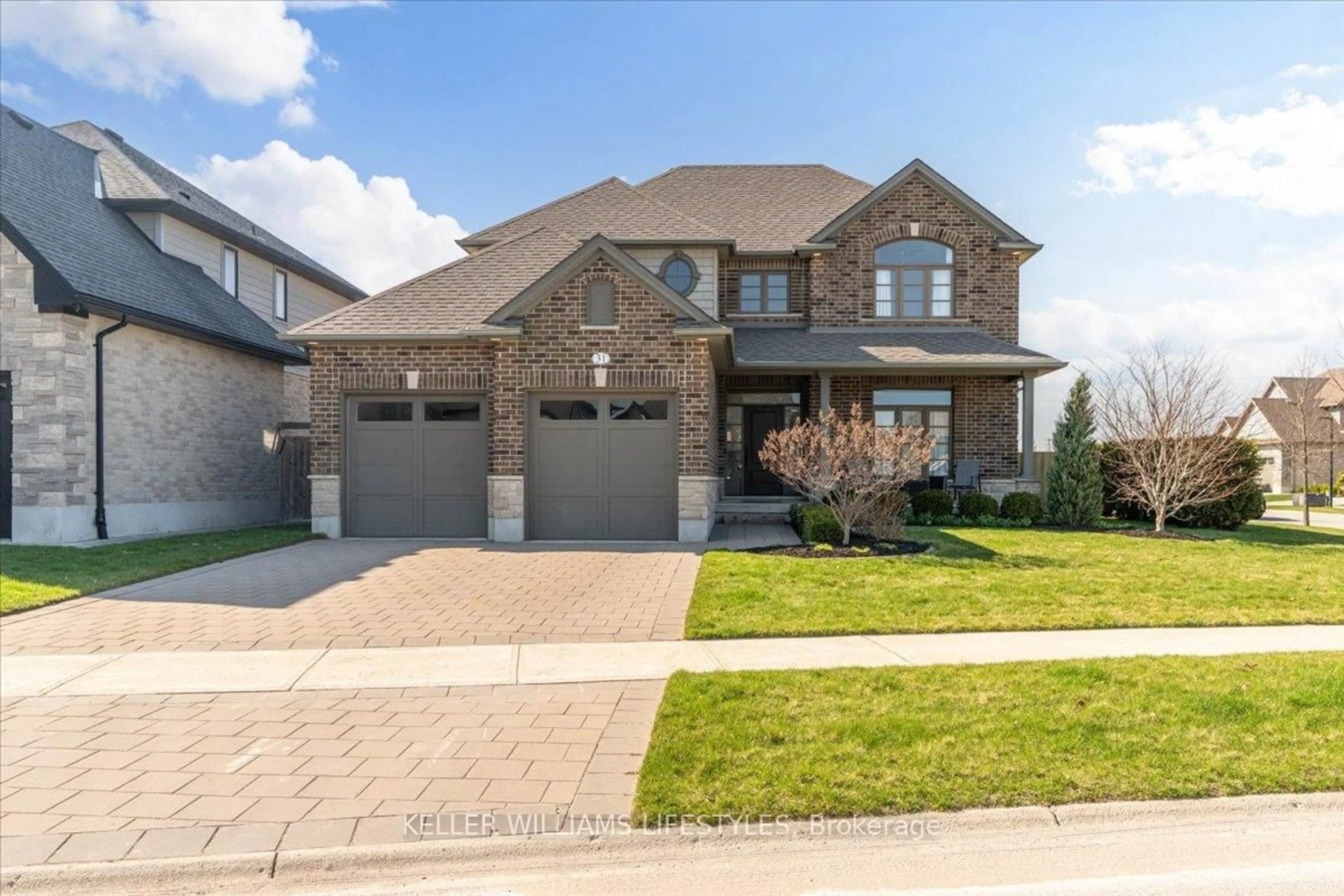 Home with brick exterior material, street for 31 Peregrine Ave, Middlesex Centre Ontario N0L 1R0