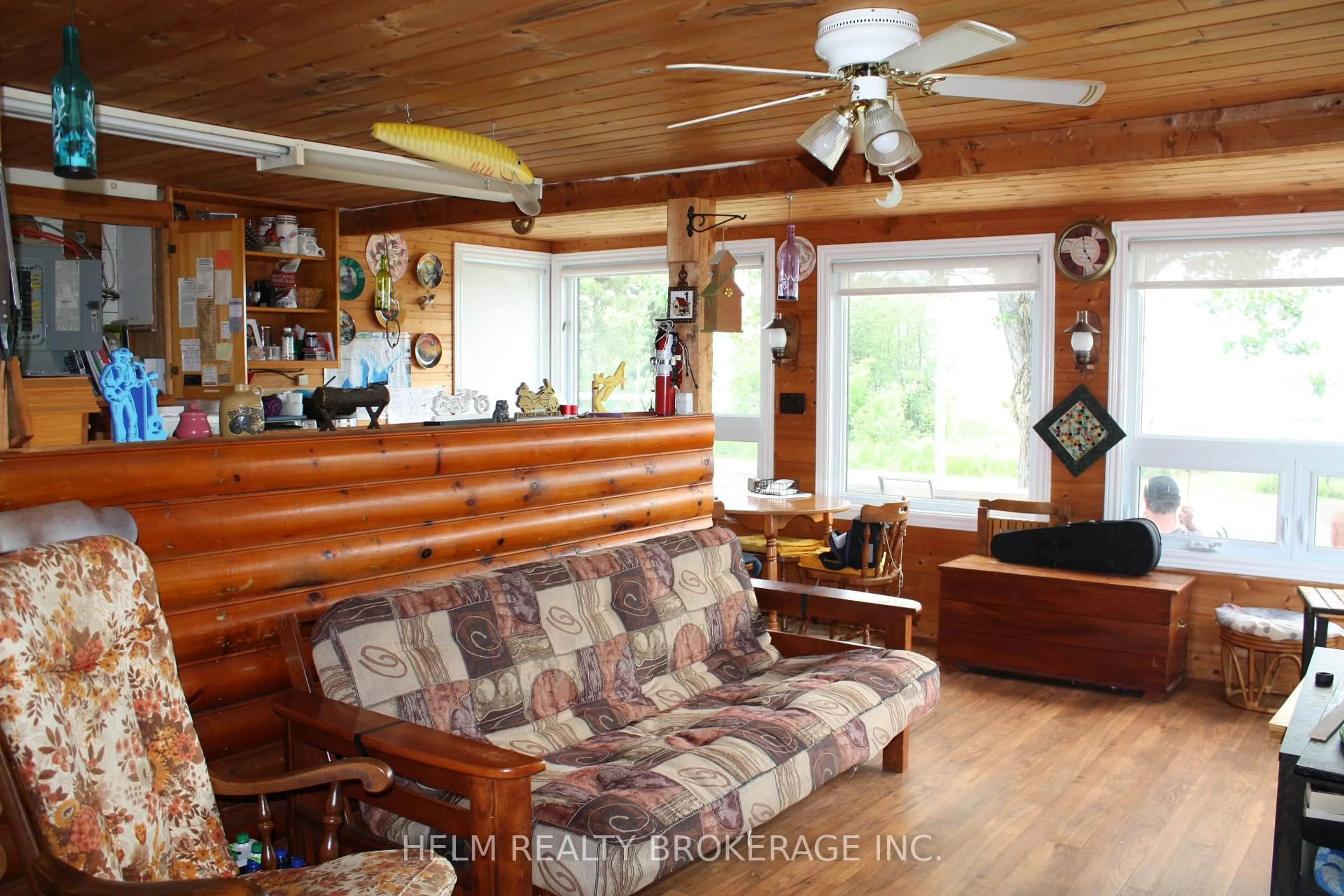 Living room with furniture, wood/laminate floor for 14 Lakeshore Rd, Bonfield Ontario P0H 1E0
