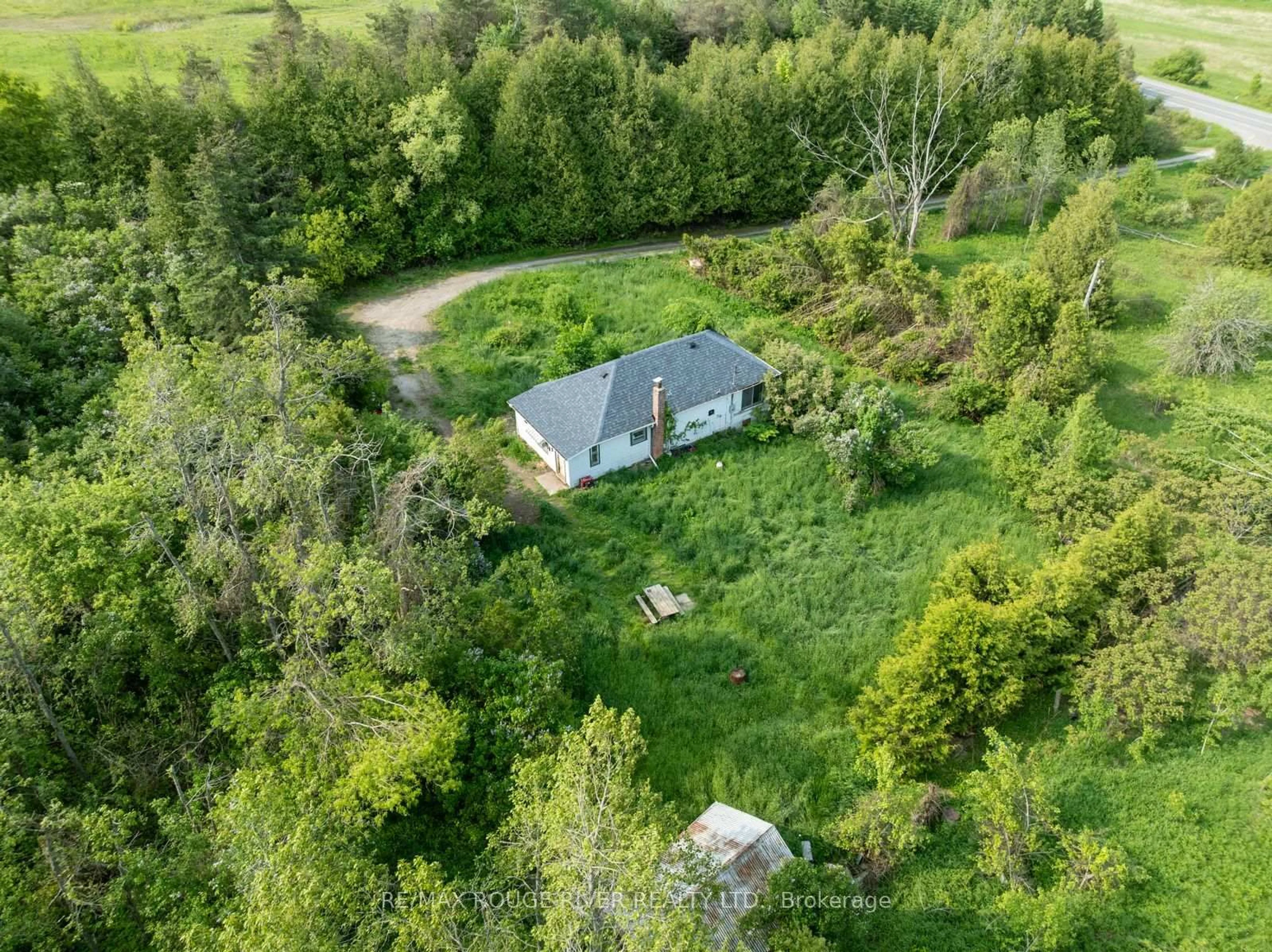 A pic from outside/outdoor area/front of a property/back of a property/a pic from drone, forest/trees view for 15 Capstick Rd, Kawartha Lakes Ontario L0A 1A0