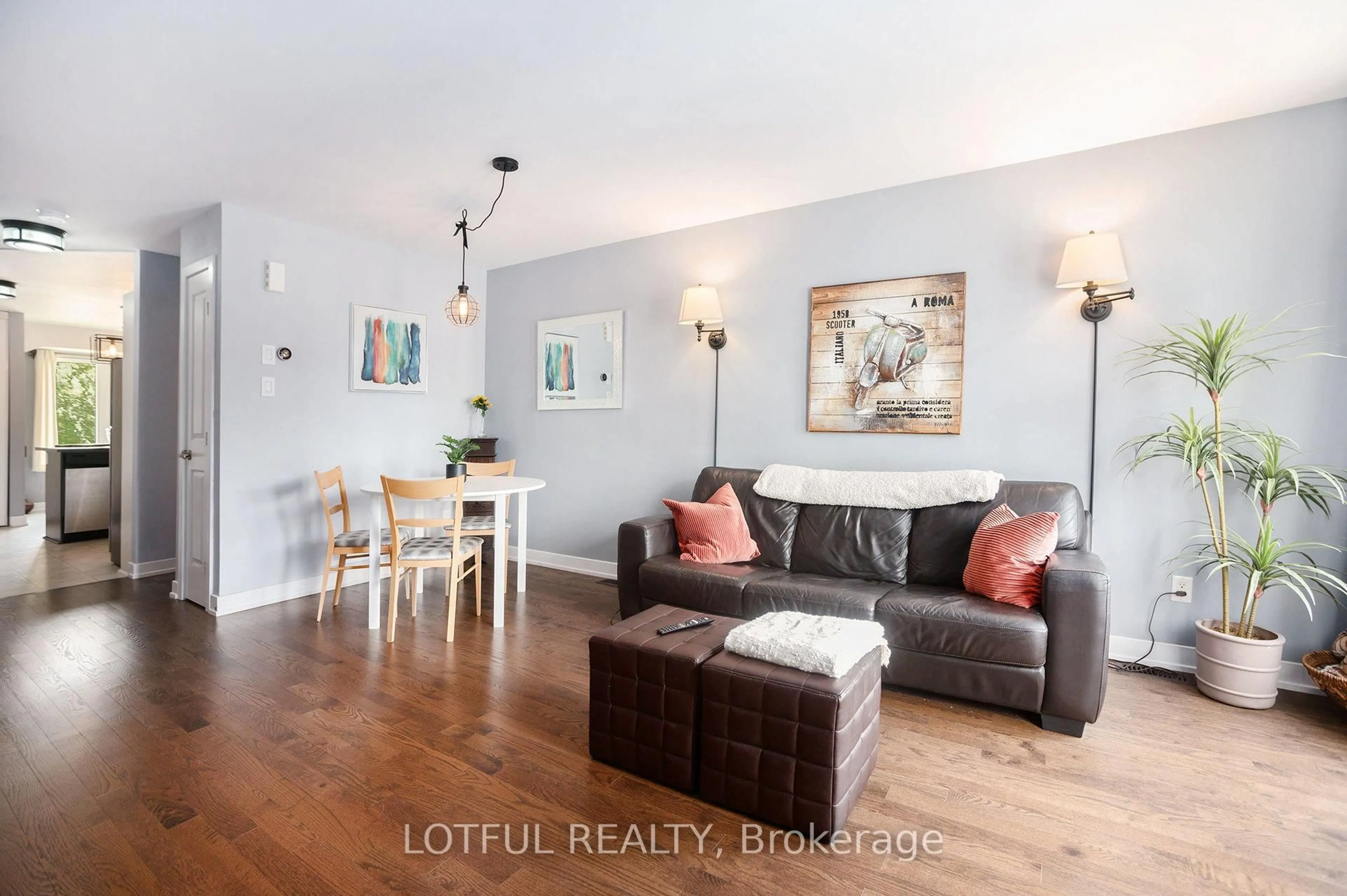 Living room with furniture, wood/laminate floor for 2016 Dorima St #A, Ottawa Ontario K4A 0X5