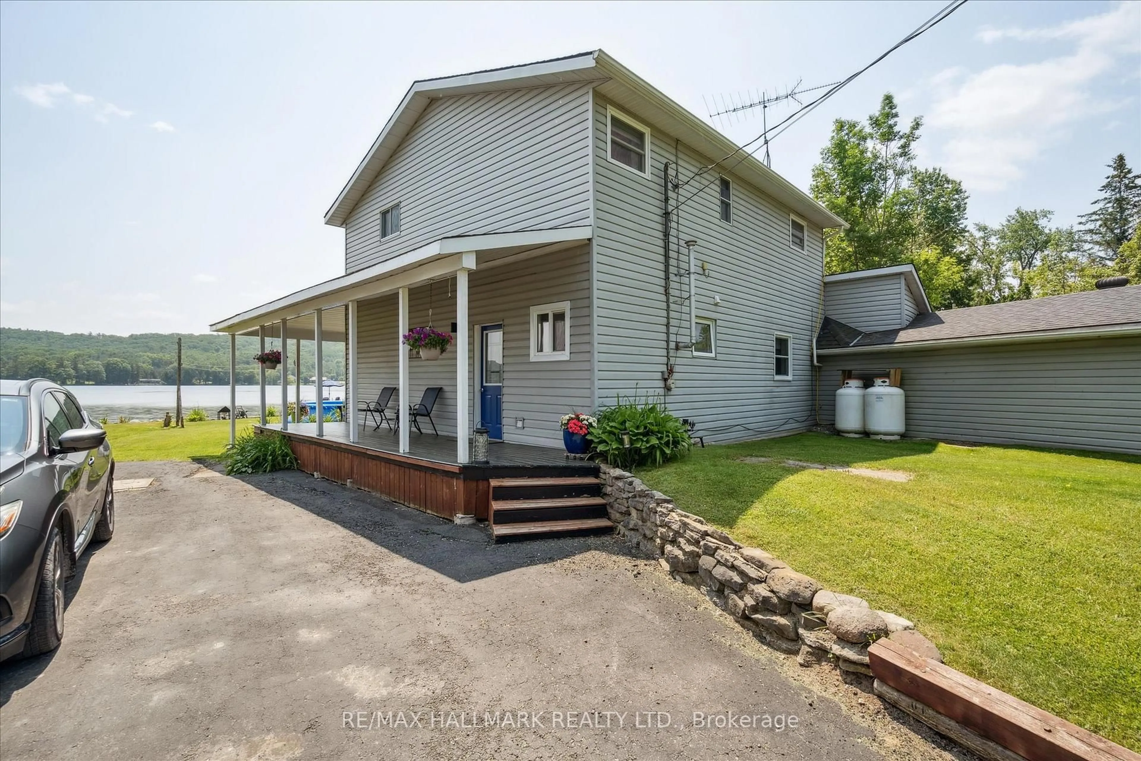 A pic from outside/outdoor area/front of a property/back of a property/a pic from drone, water/lake/river/ocean view for 165 Trentside Lane, Hastings Ontario K0K 2C0