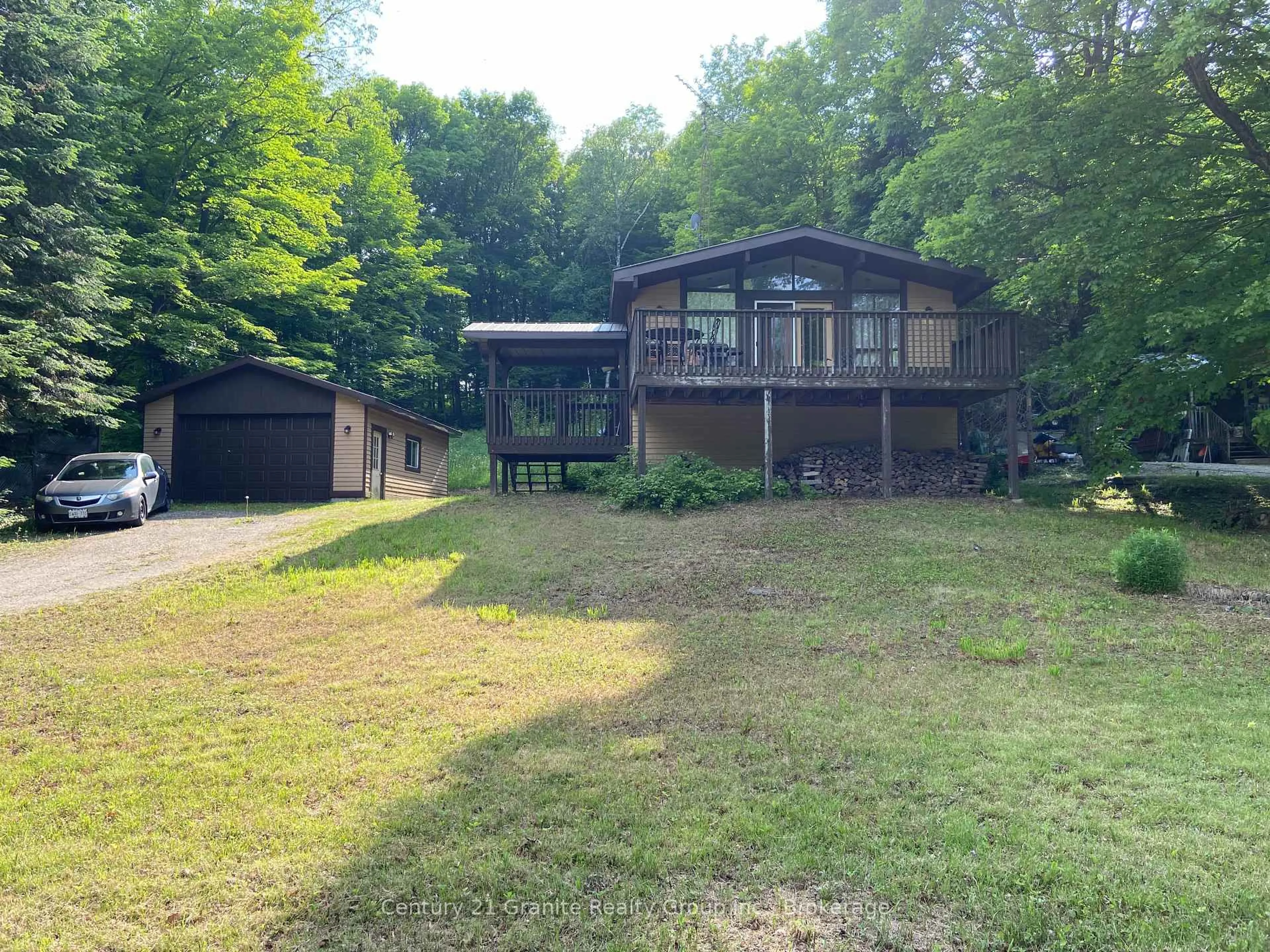A pic from outside/outdoor area/front of a property/back of a property/a pic from drone, unknown for 1549 Trappers Trail Rd, Dysart et al Ontario K0M 1S0