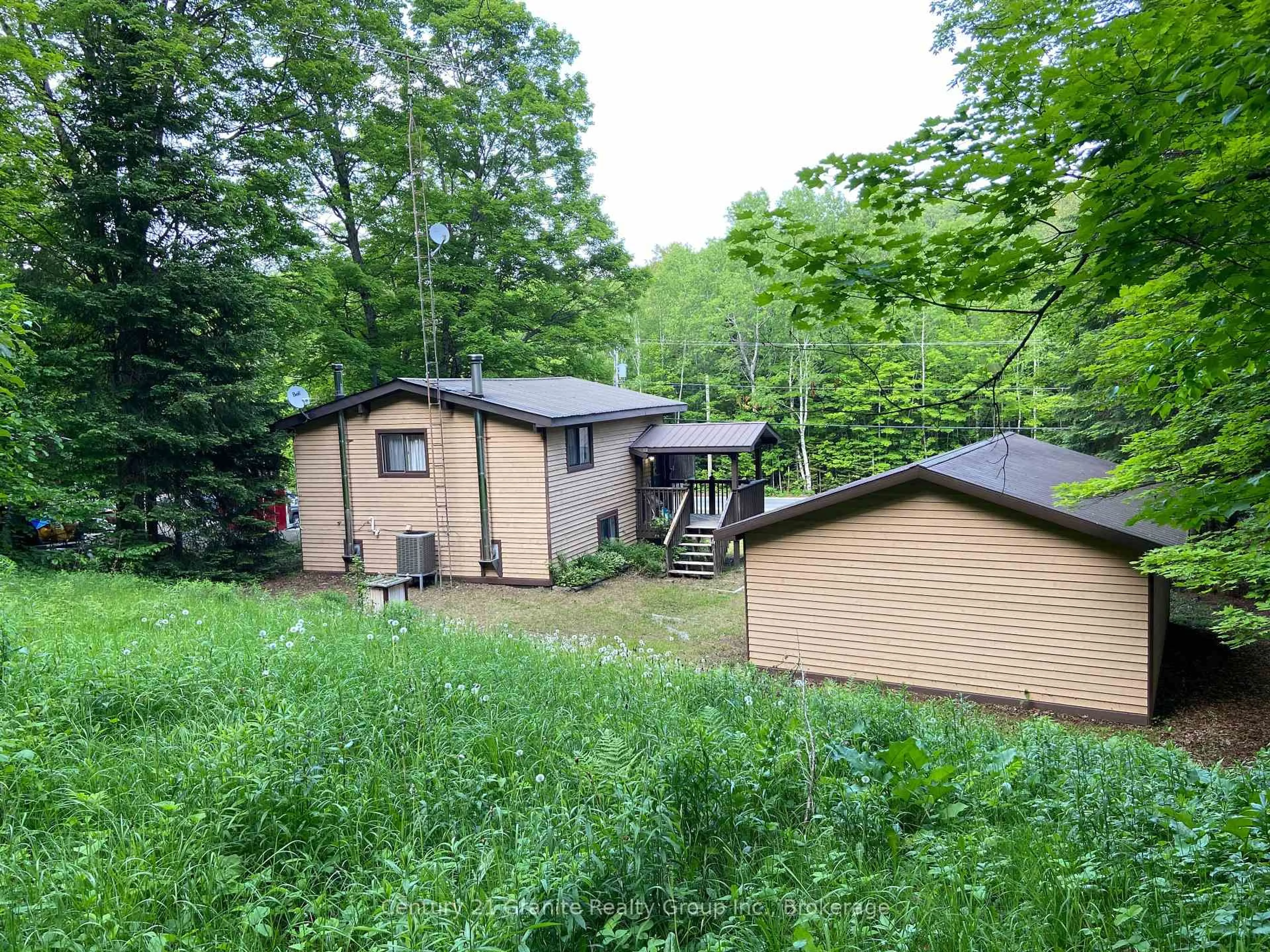 A pic from outside/outdoor area/front of a property/back of a property/a pic from drone, forest/trees view for 1549 Trappers Trail Rd, Dysart et al Ontario K0M 1S0