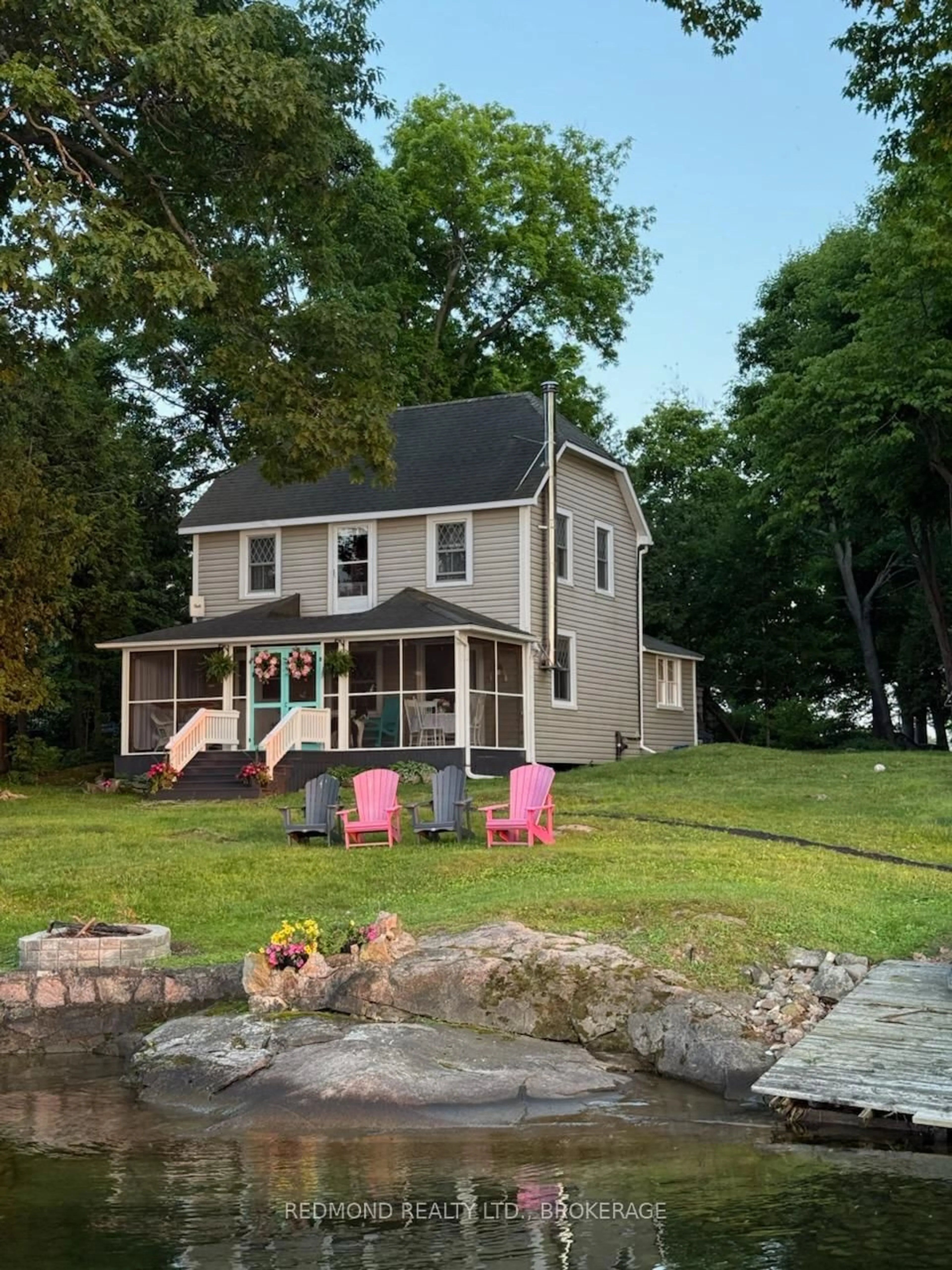 A pic from outside/outdoor area/front of a property/back of a property/a pic from drone, unknown for 70 Tremont Park Island, Gananoque Ontario K7G 2V5