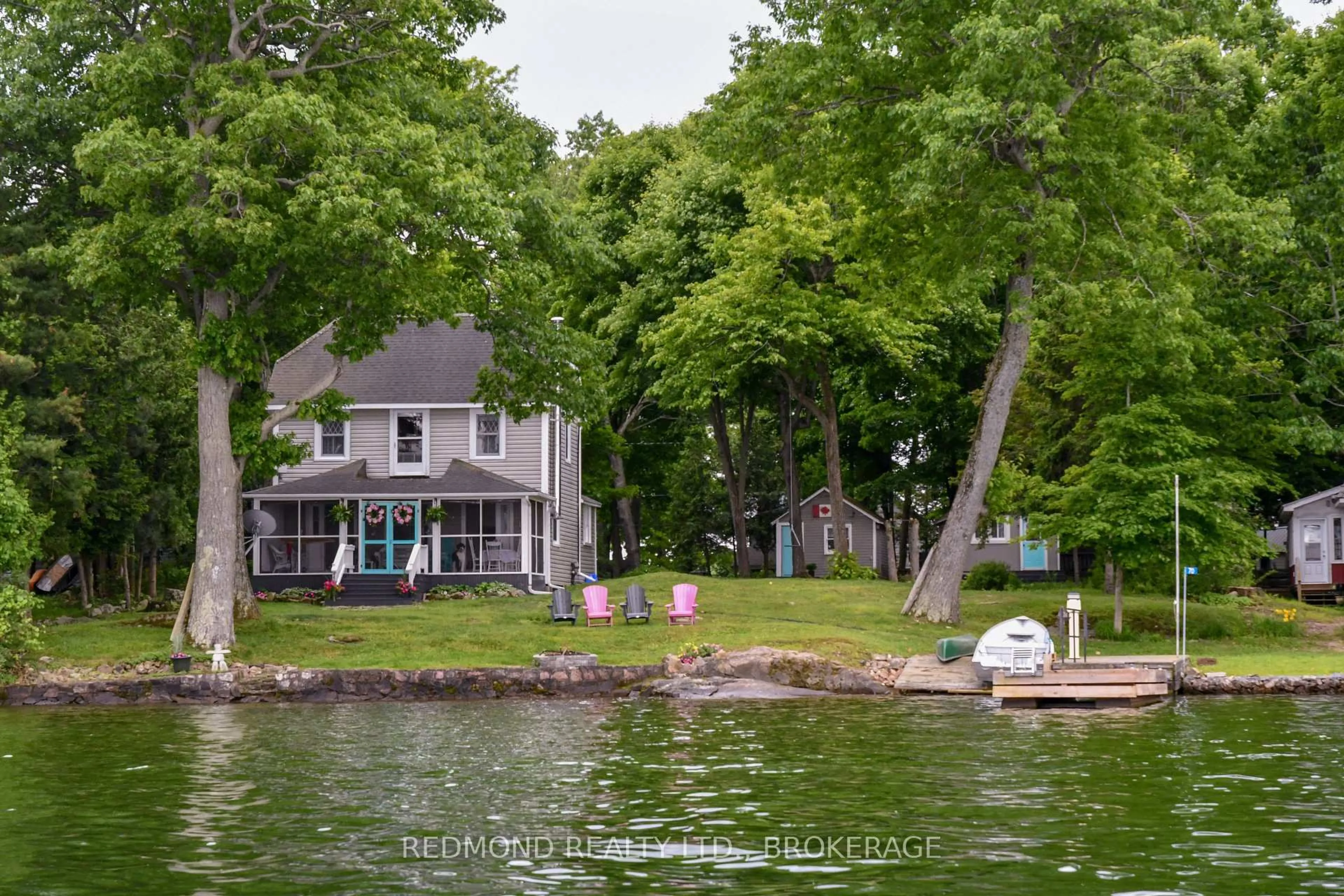 A pic from outside/outdoor area/front of a property/back of a property/a pic from drone, water/lake/river/ocean view for 70 Tremont Park Island, Gananoque Ontario K7G 2V5