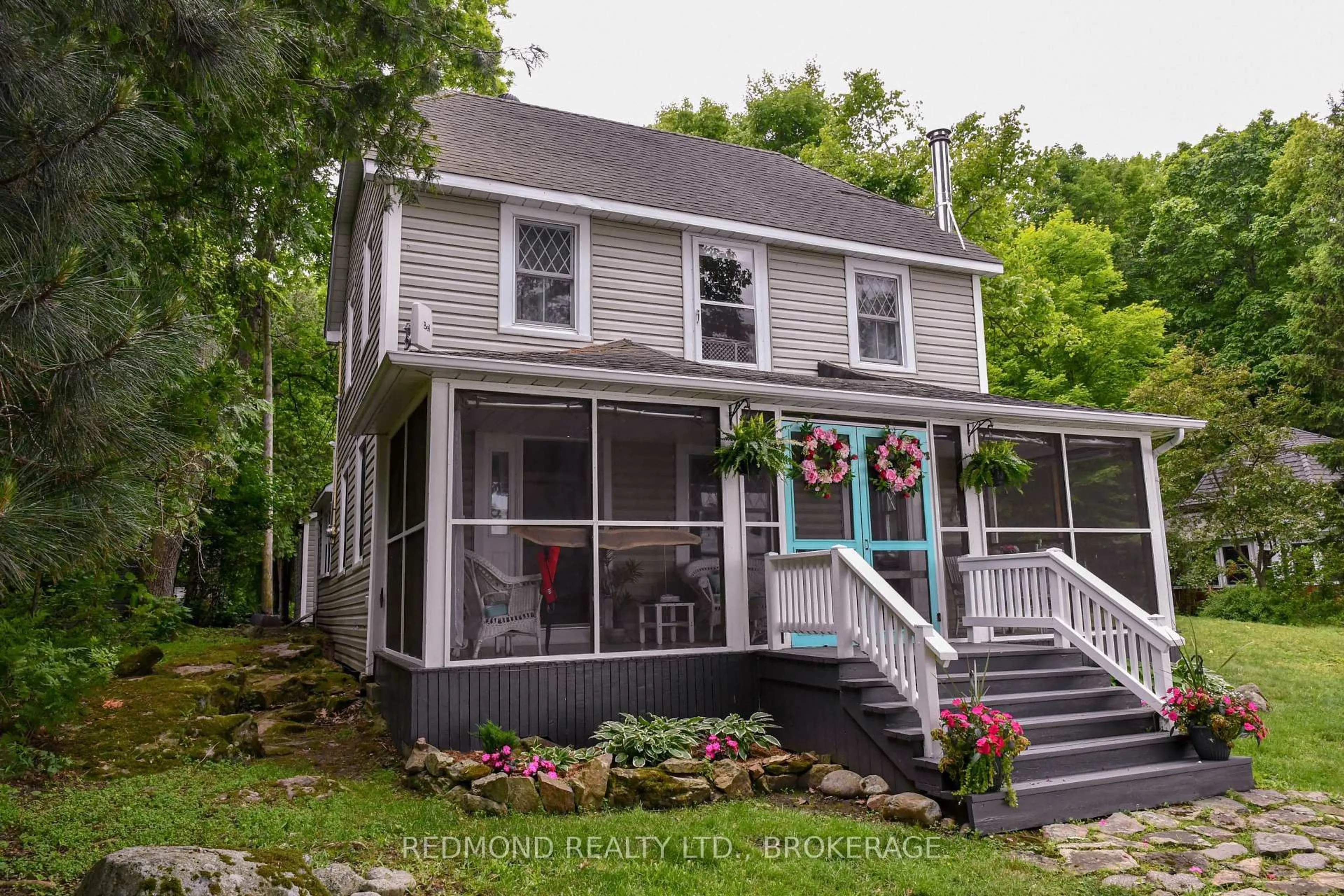 Home with vinyl exterior material, street for 70 Tremont Park Island, Gananoque Ontario K7G 2V5
