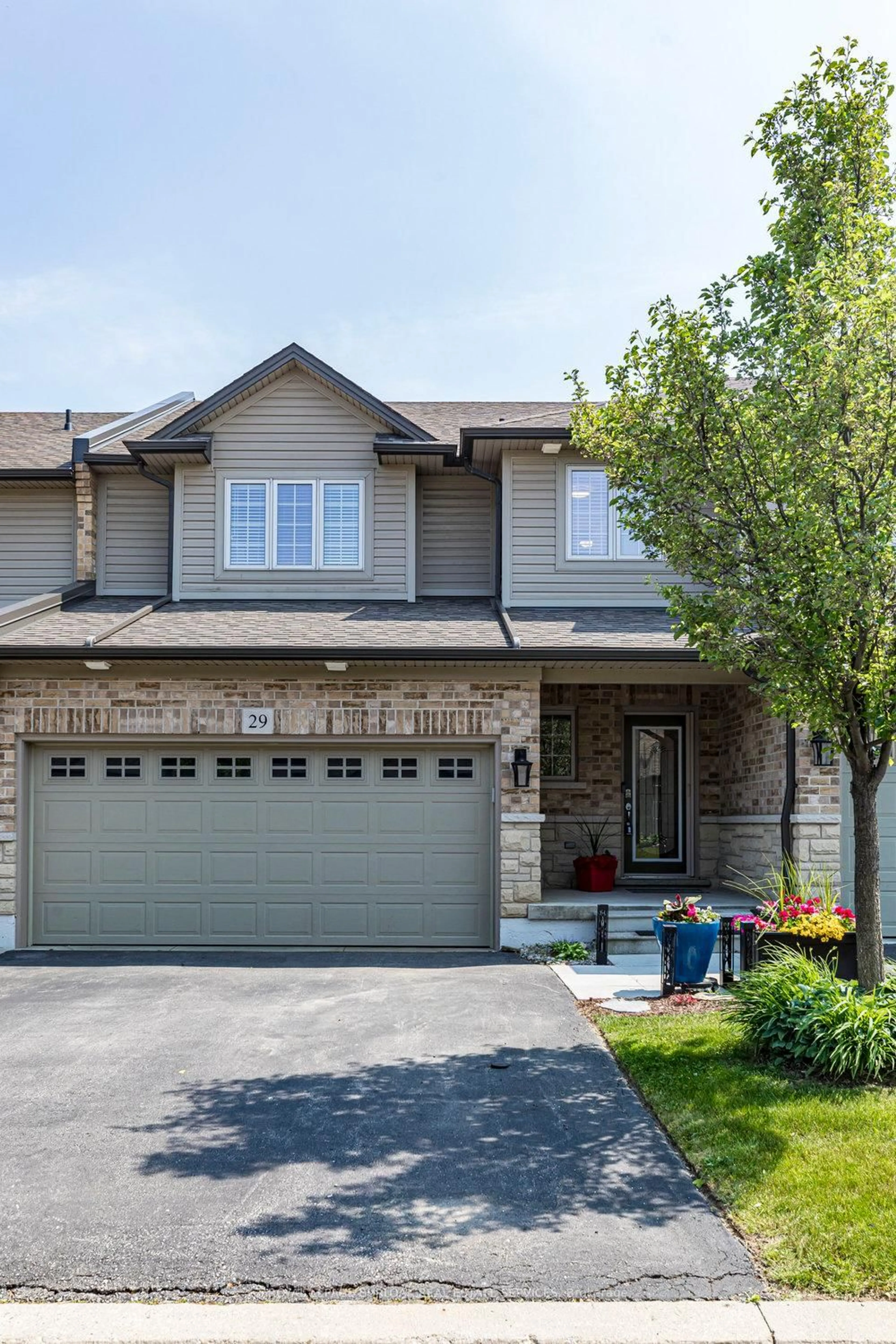 Home with brick exterior material, street for 441 Stonehenge Dr #29, Hamilton Ontario L9K 0B1