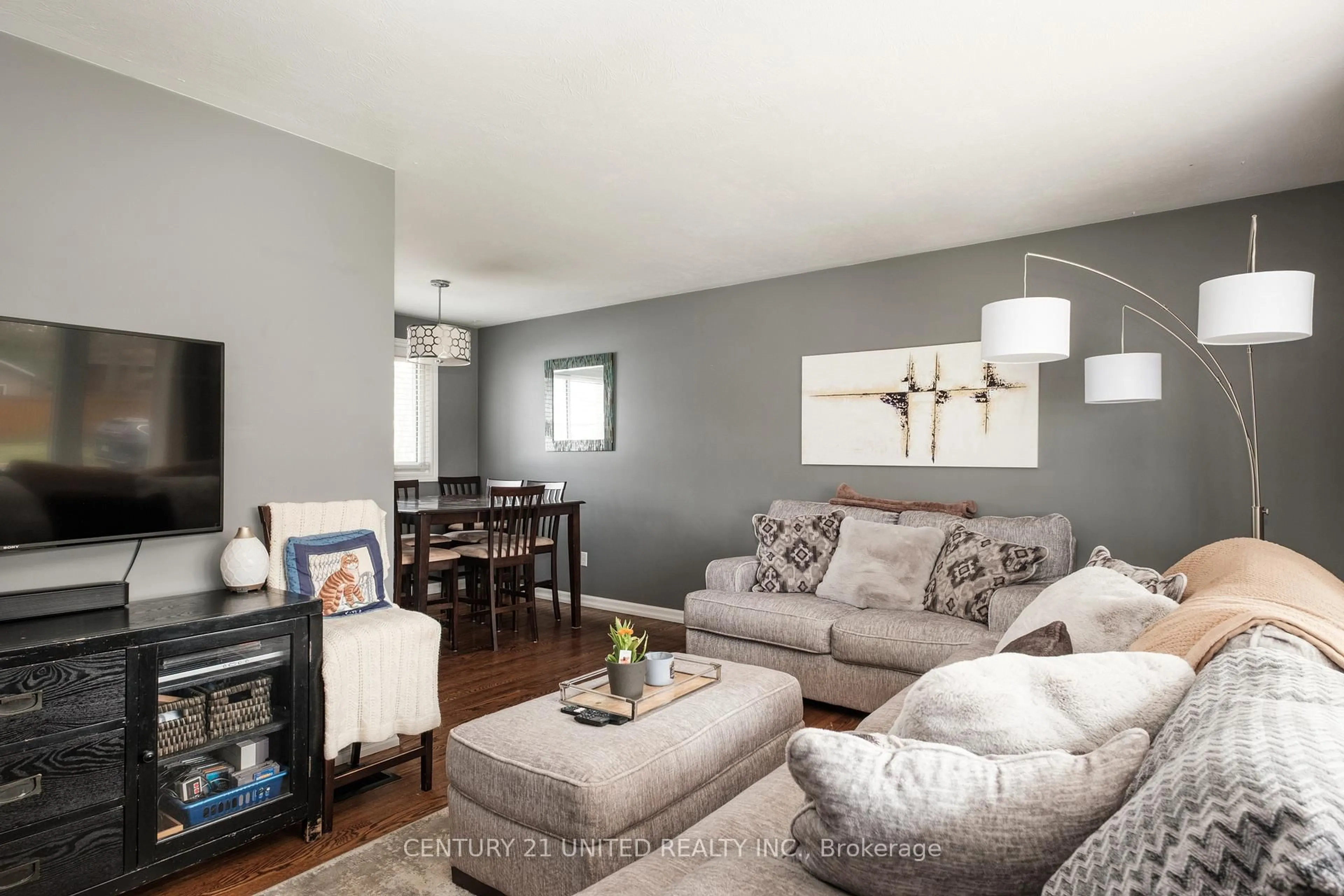Living room with furniture, wood/laminate floor for 1316 Bathurst St, Peterborough North Ontario K9H 6X9
