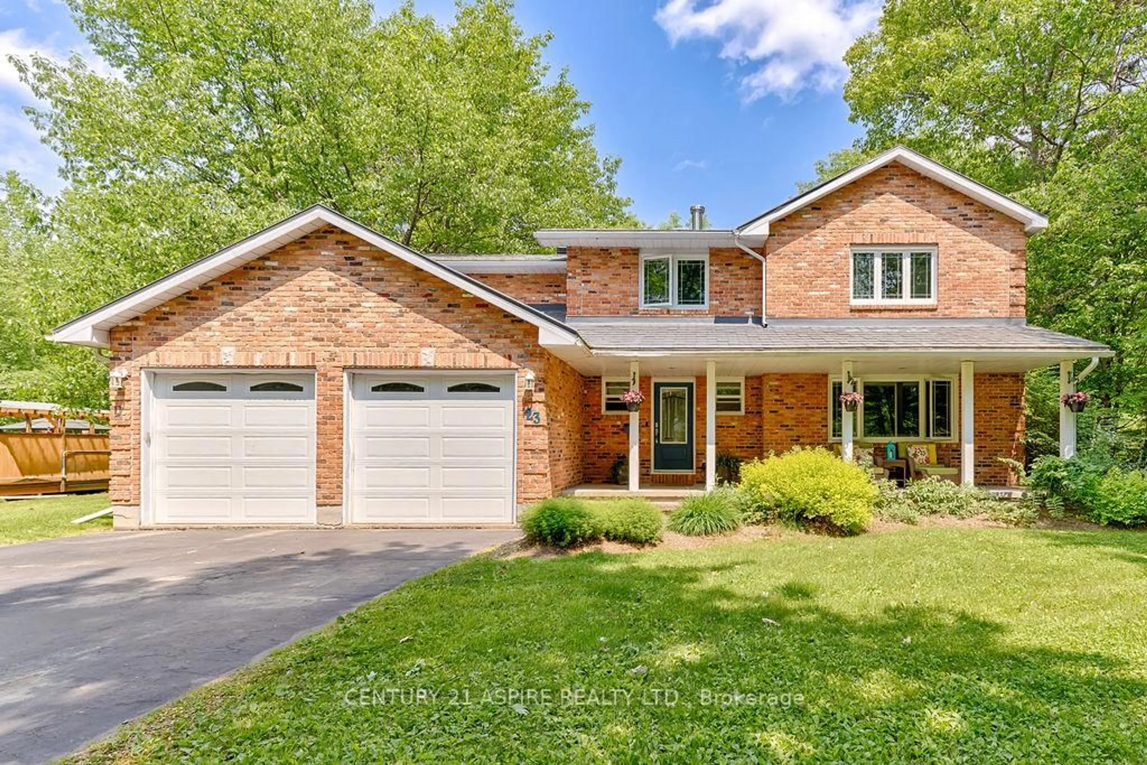 Home with brick exterior material, street for 23 Country Lane, Petawawa Ontario K8H 3E2