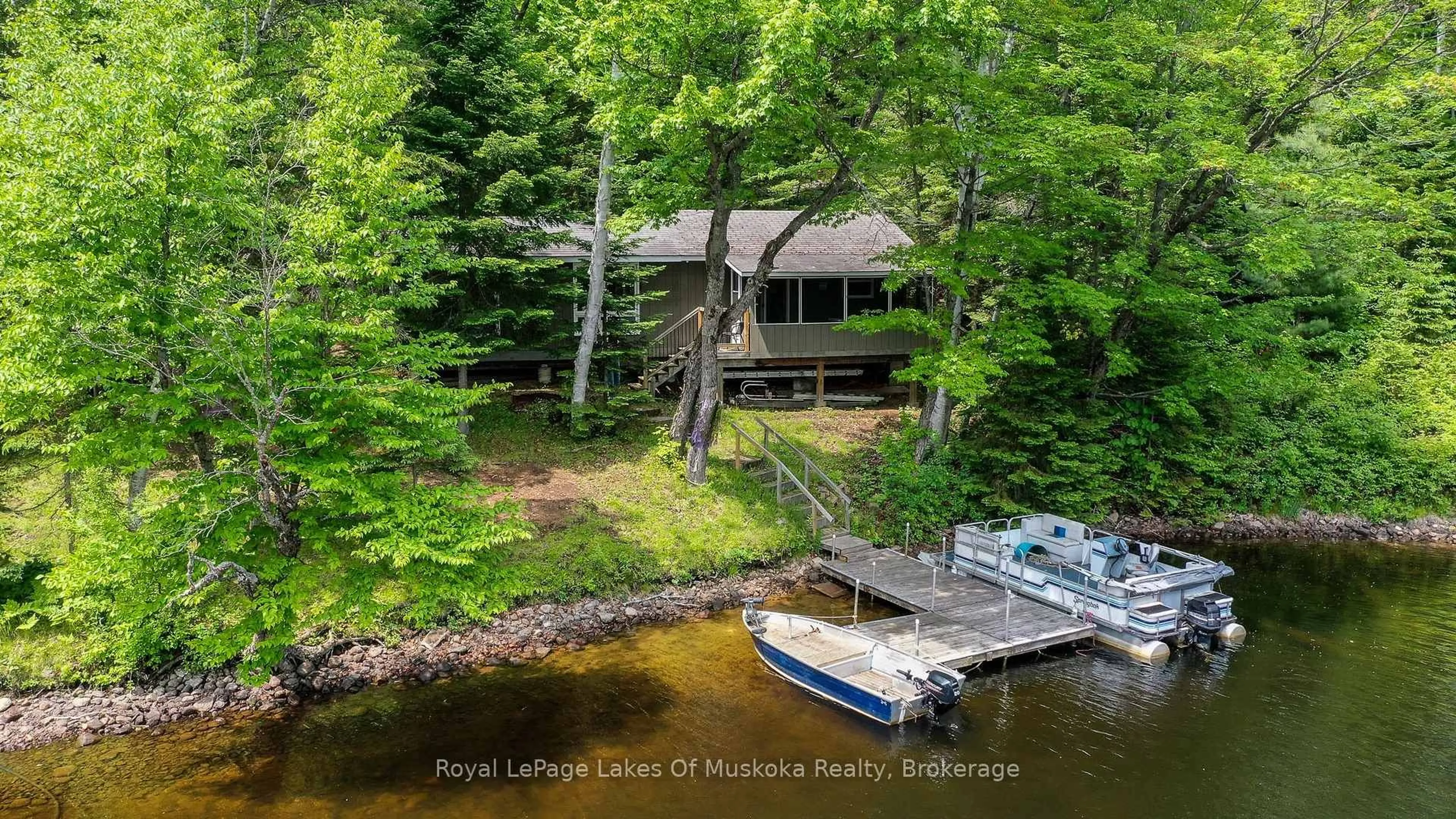 A pic from outside/outdoor area/front of a property/back of a property/a pic from drone, water/lake/river/ocean view for 119 Sunken Island Lane, Kearney Ontario P0A 1M0