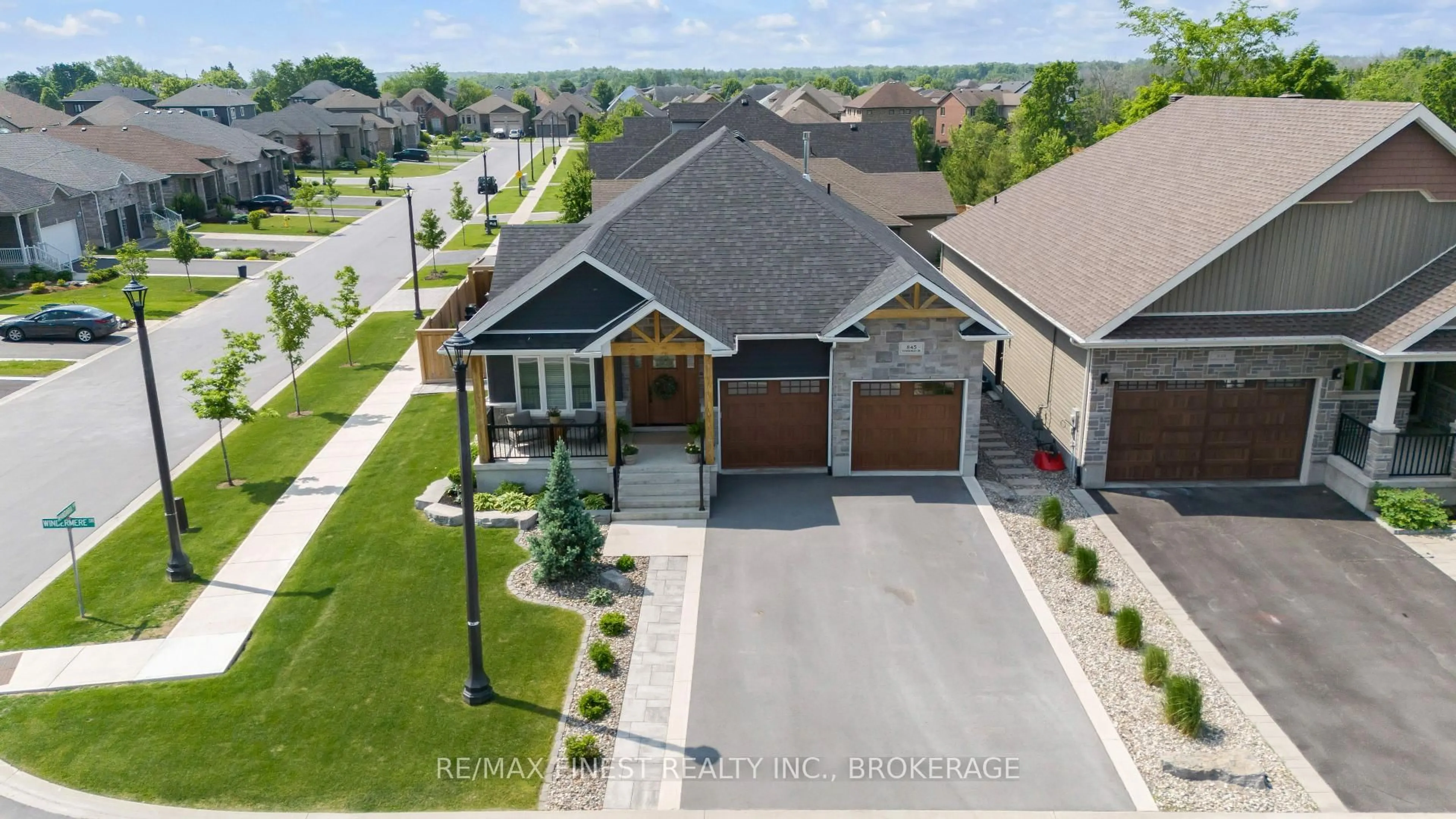 A pic from outside/outdoor area/front of a property/back of a property/a pic from drone, street for 845 Windermere Dr, Kingston Ontario K7P 0N5