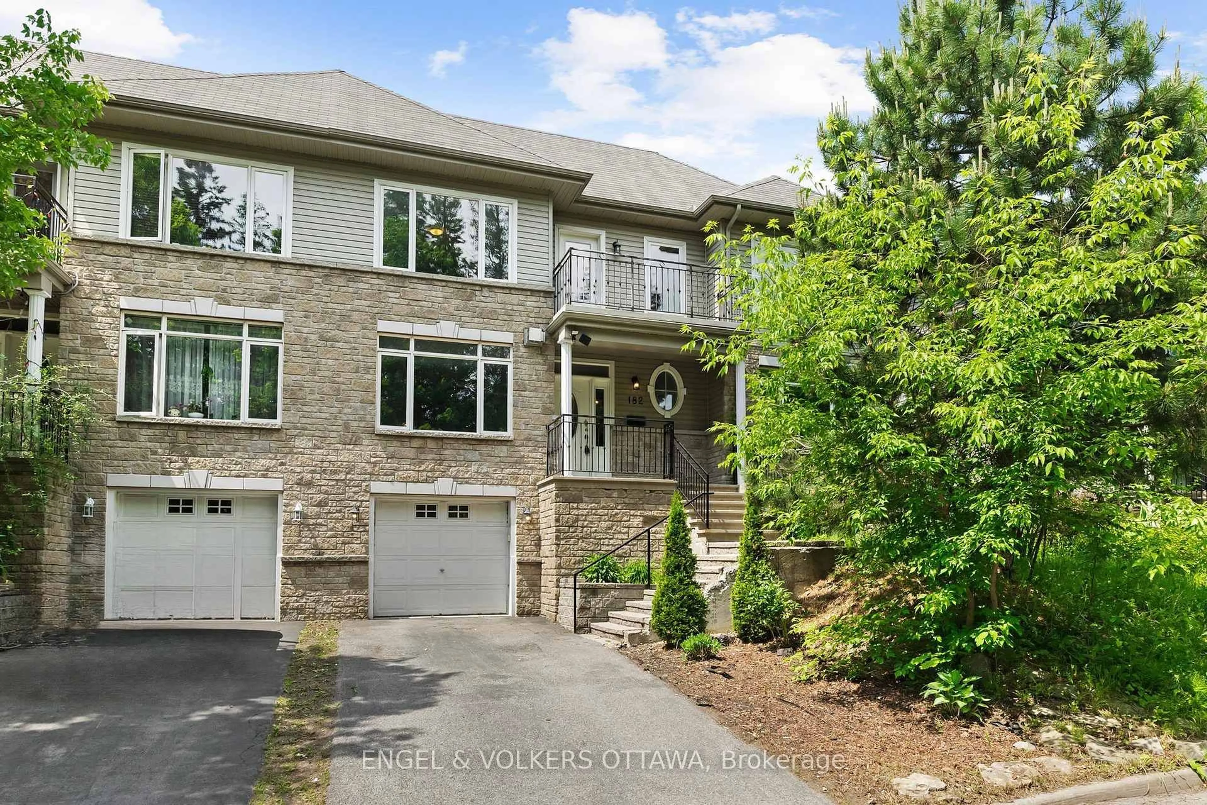 Home with brick exterior material, street for 182 Meandering Brook Dr, Ottawa Ontario K1T 0C3