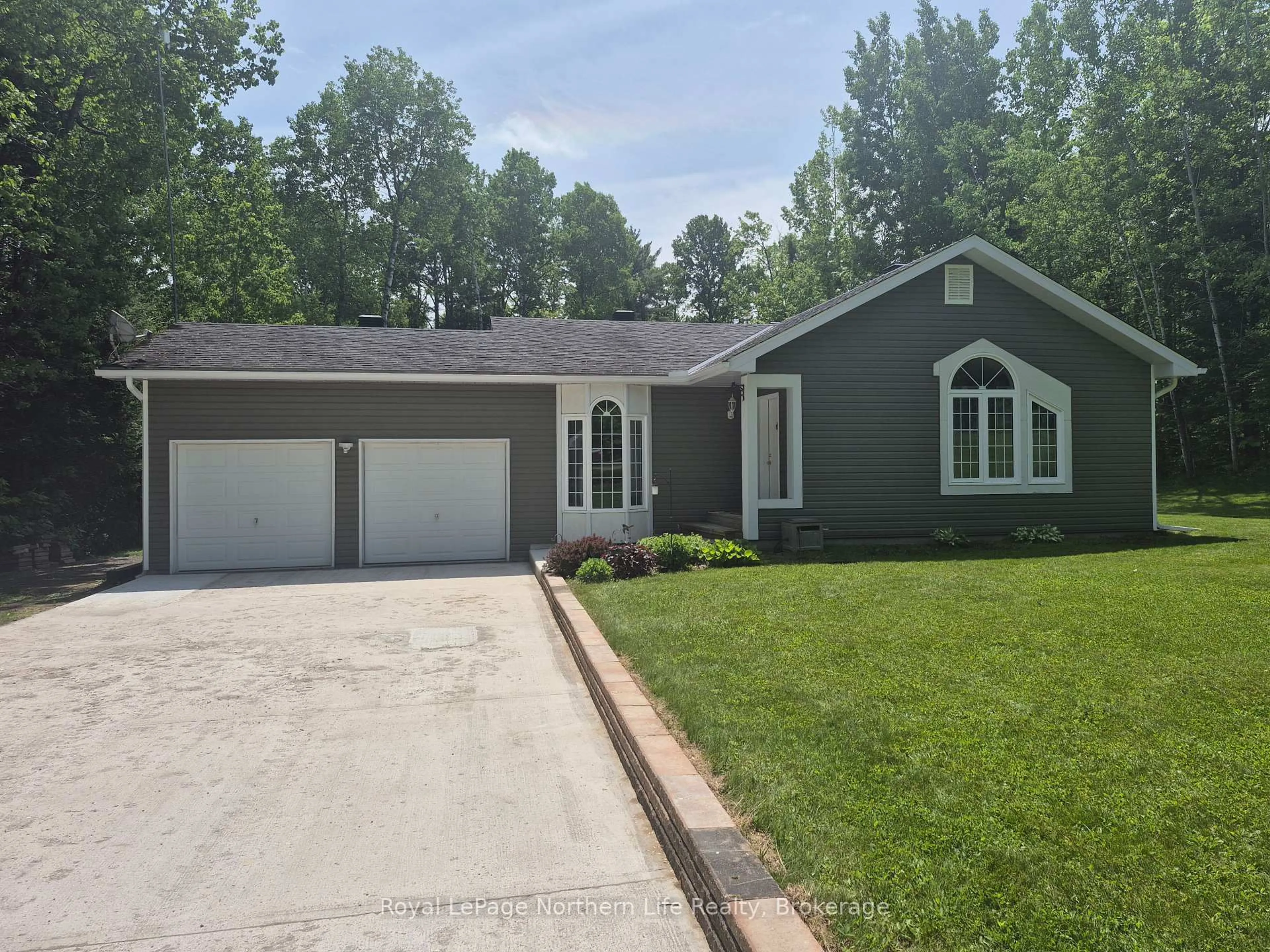 Home with vinyl exterior material, street for 1140 Von Doeler Rd, Bonfield Ontario P0H 2E0