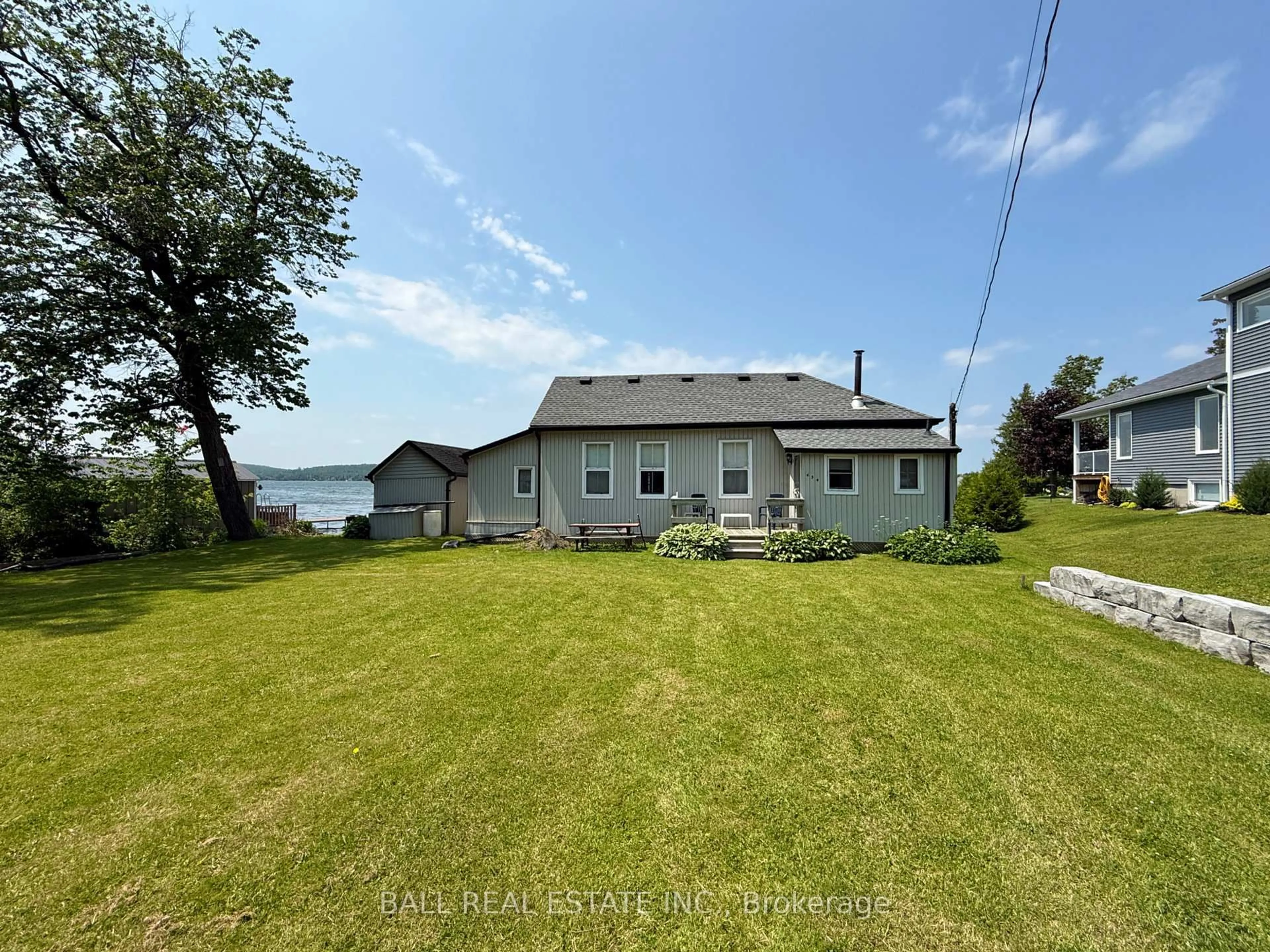 A pic from outside/outdoor area/front of a property/back of a property/a pic from drone, water/lake/river/ocean view for 654 Hatton Ave, Selwyn Ontario K0L 1H0